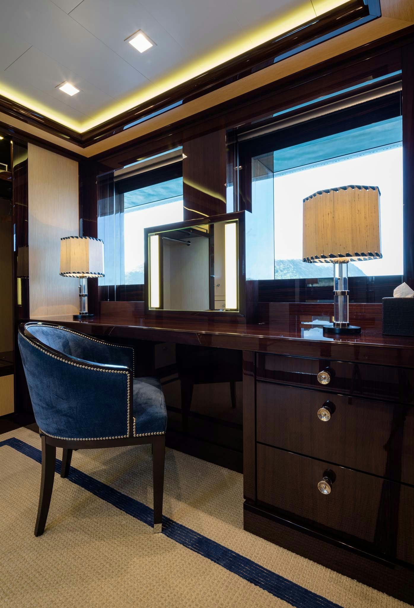 a room with a desk and a chair aboard AXIOMA Yacht for Charter