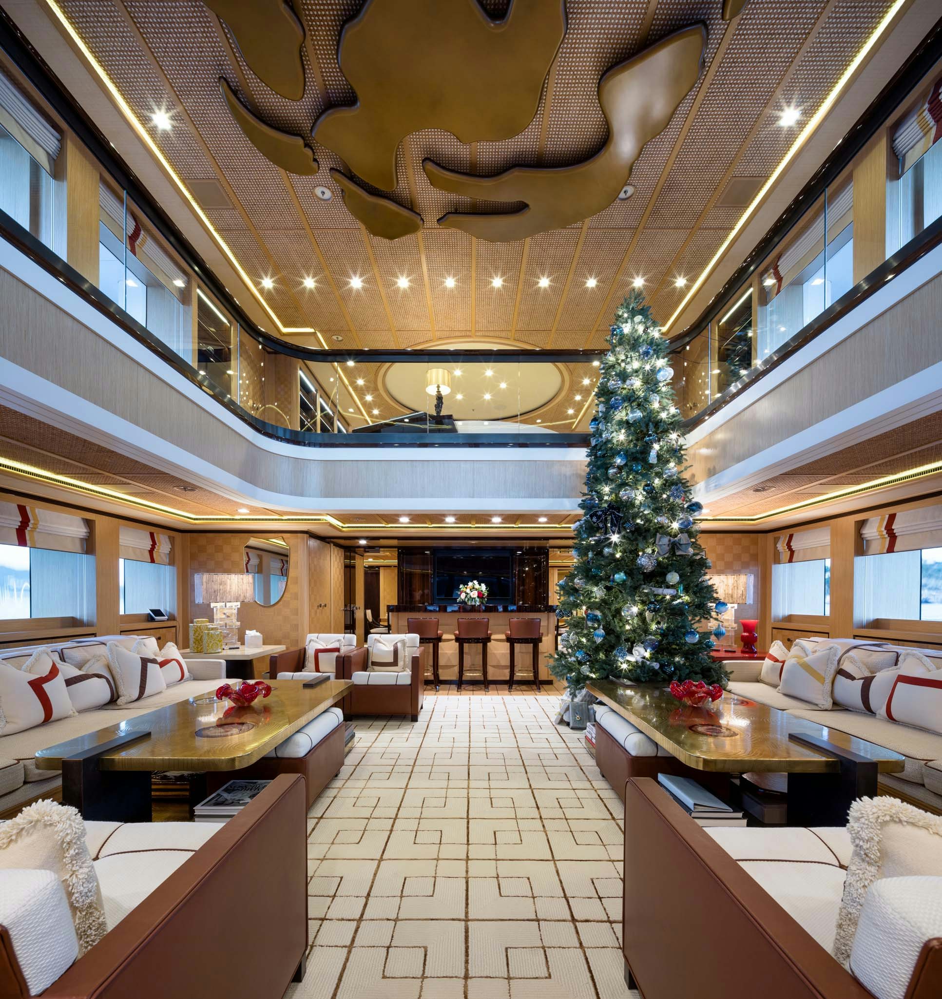 a large room with a christmas tree aboard AXIOMA Yacht for Charter