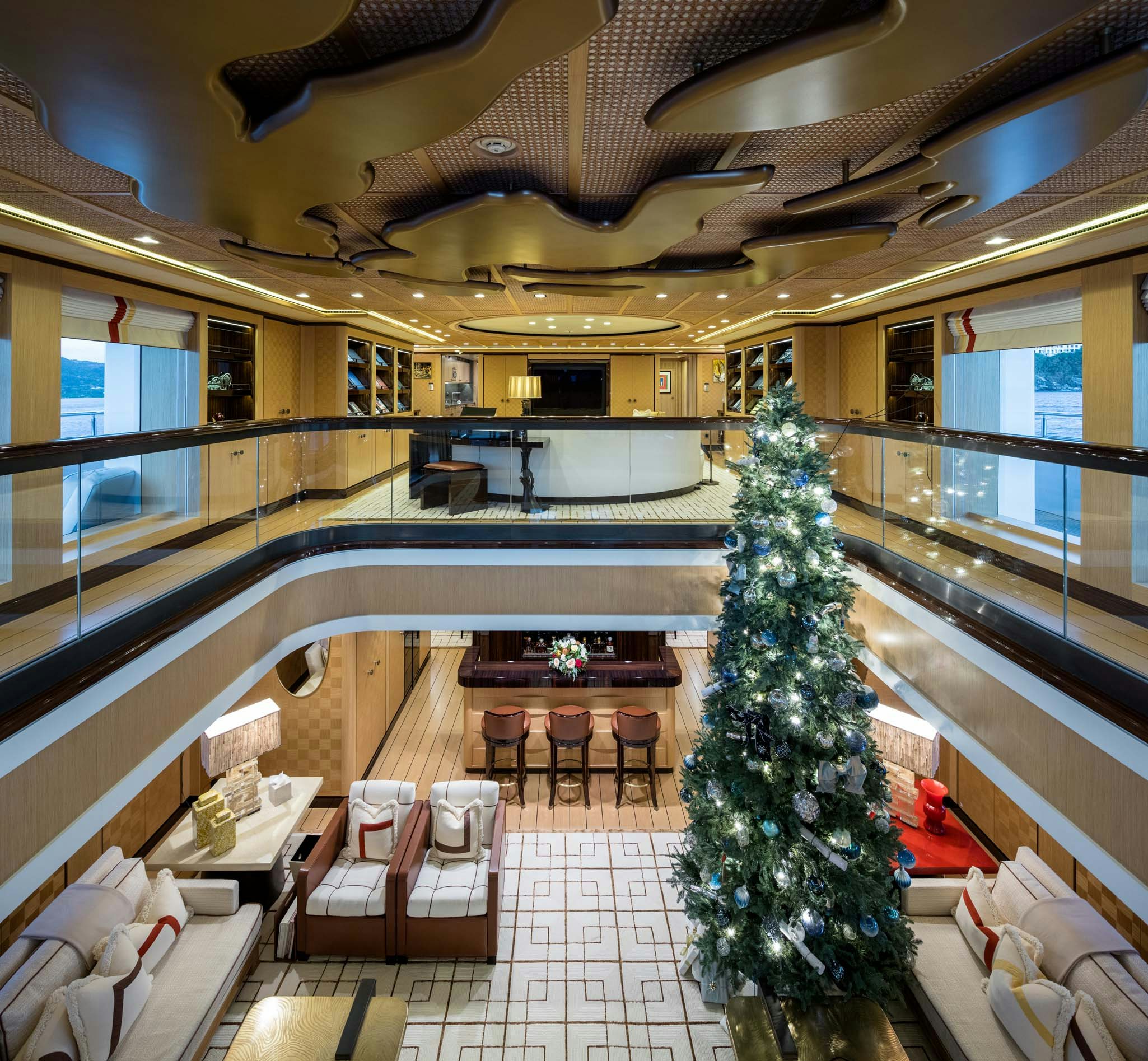 a large room with a christmas tree aboard AXIOMA Yacht for Charter