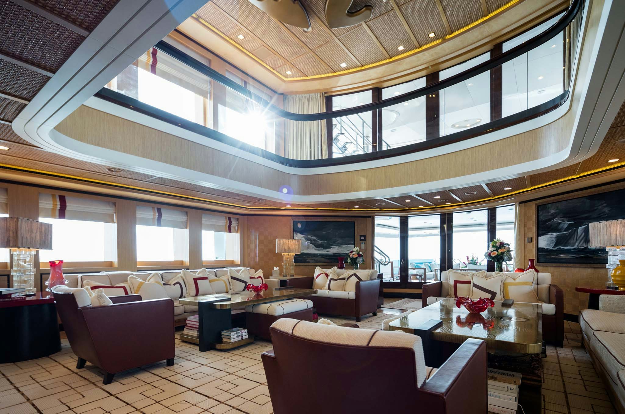 a large room with couches and tables aboard AXIOMA Yacht for Charter