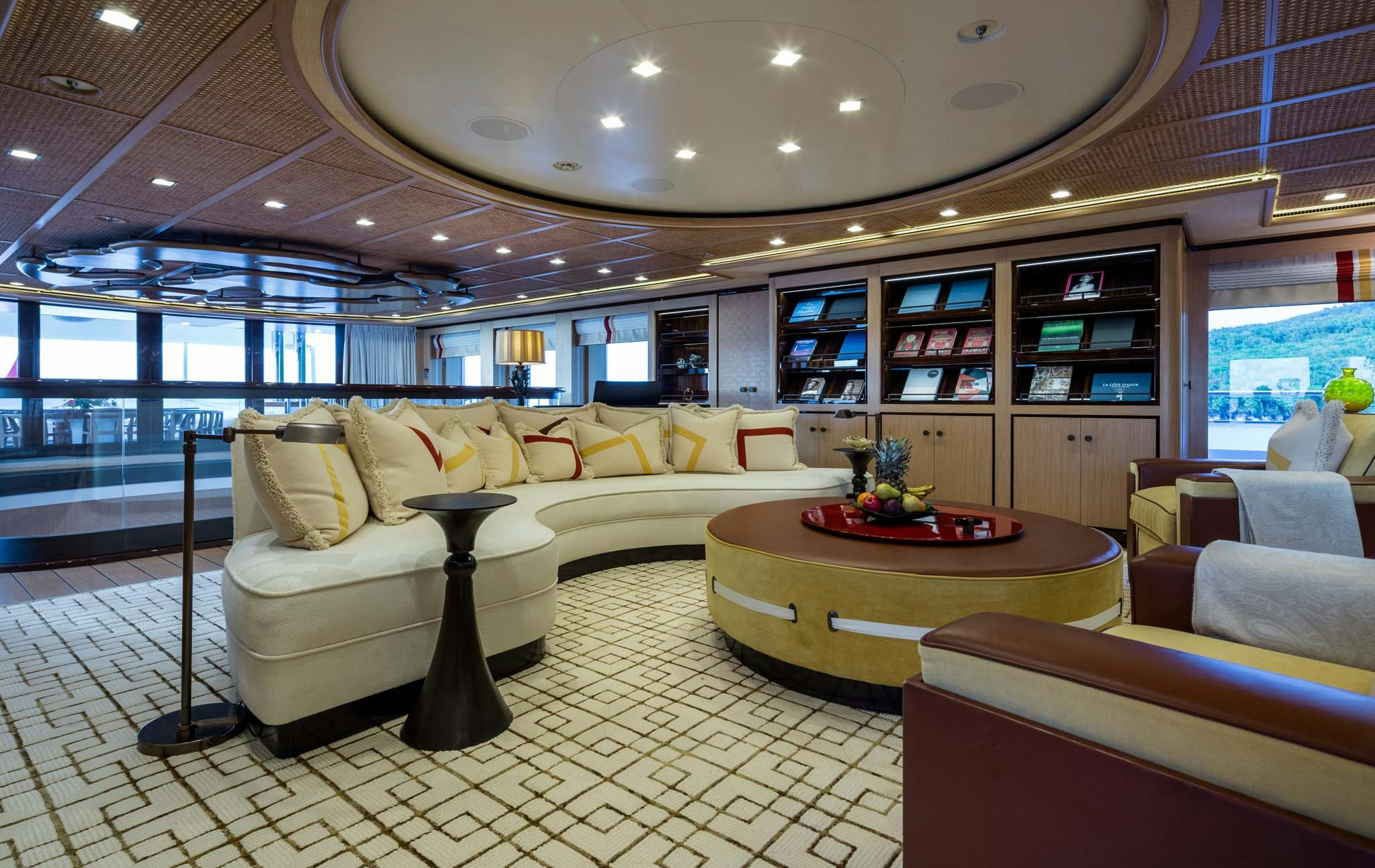 a large living room with a large glass ceiling aboard AXIOMA Yacht for Charter