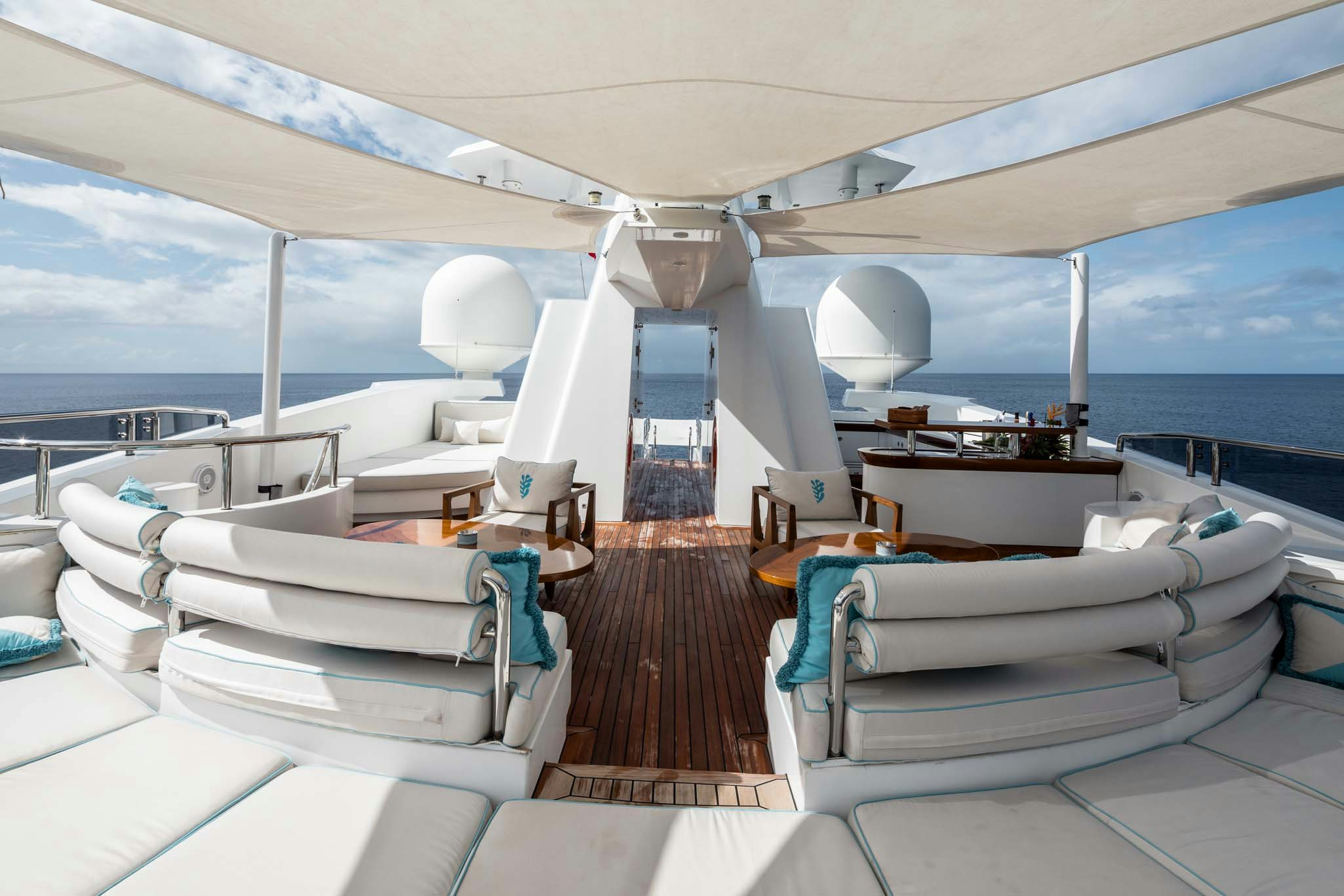 a large room with a view of the ocean and the deck aboard AXIOMA Yacht for Charter