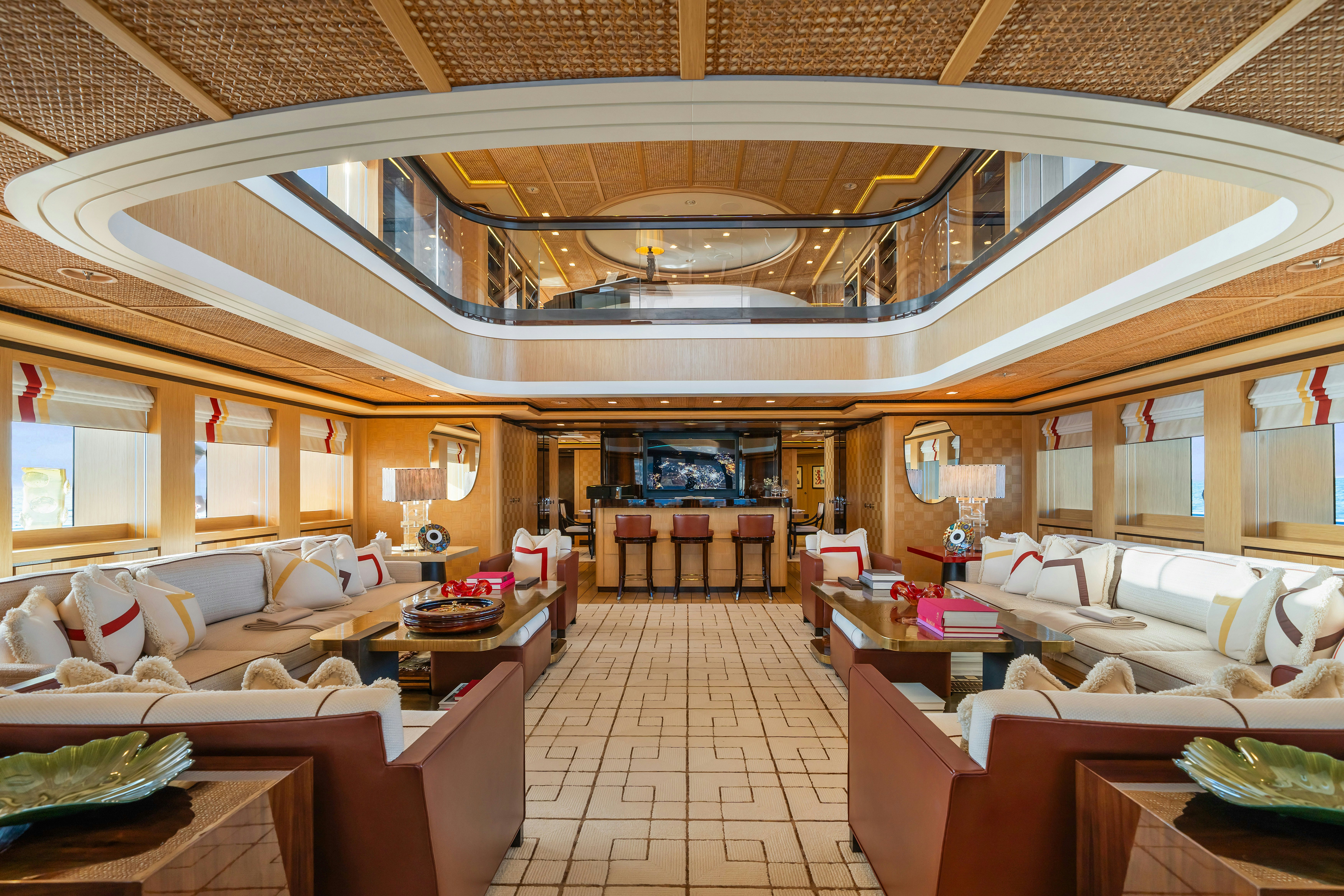 a large room with many couches aboard AXIOMA Yacht for Sale