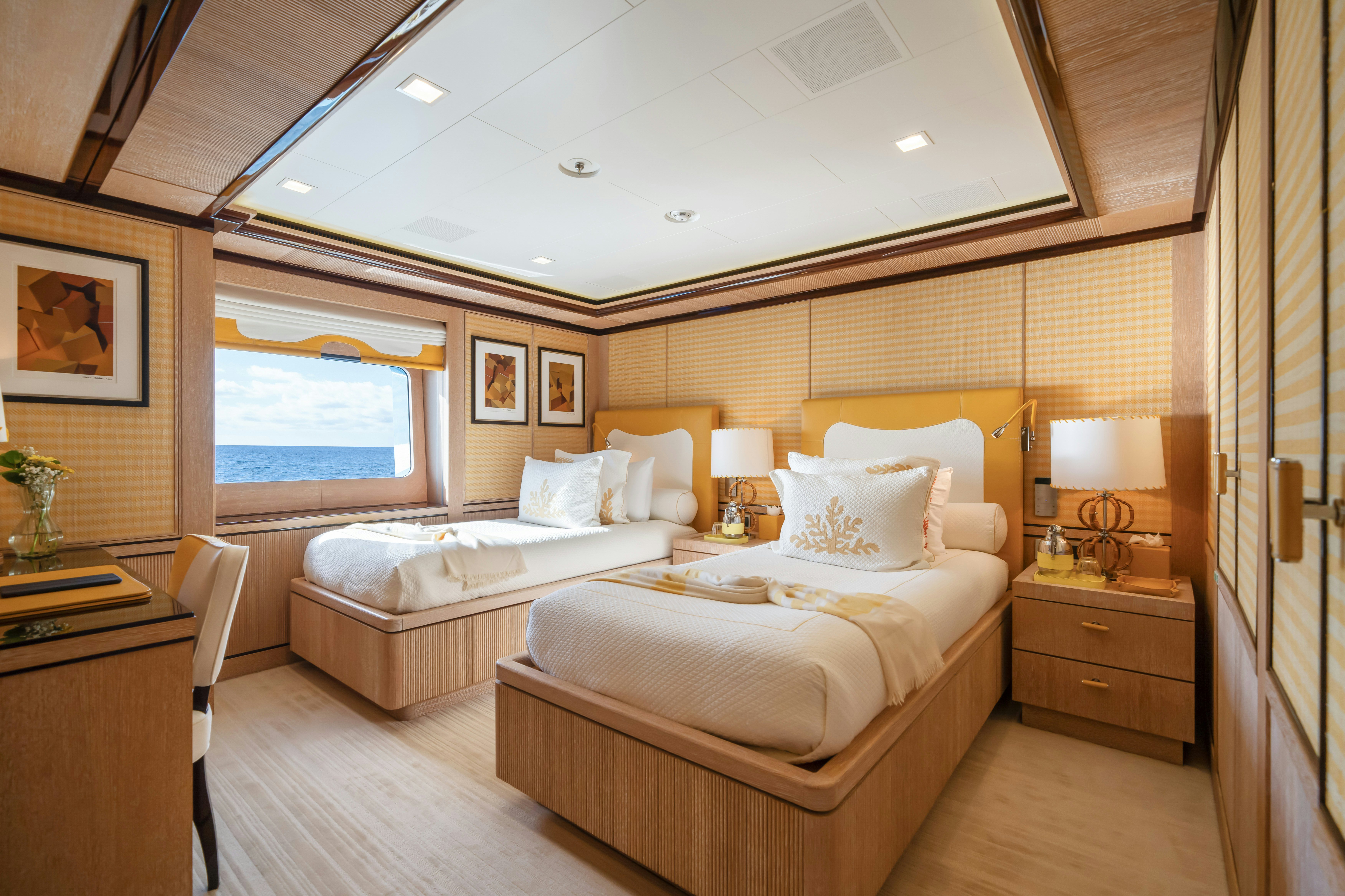 a room with two beds aboard AXIOMA Yacht for Sale