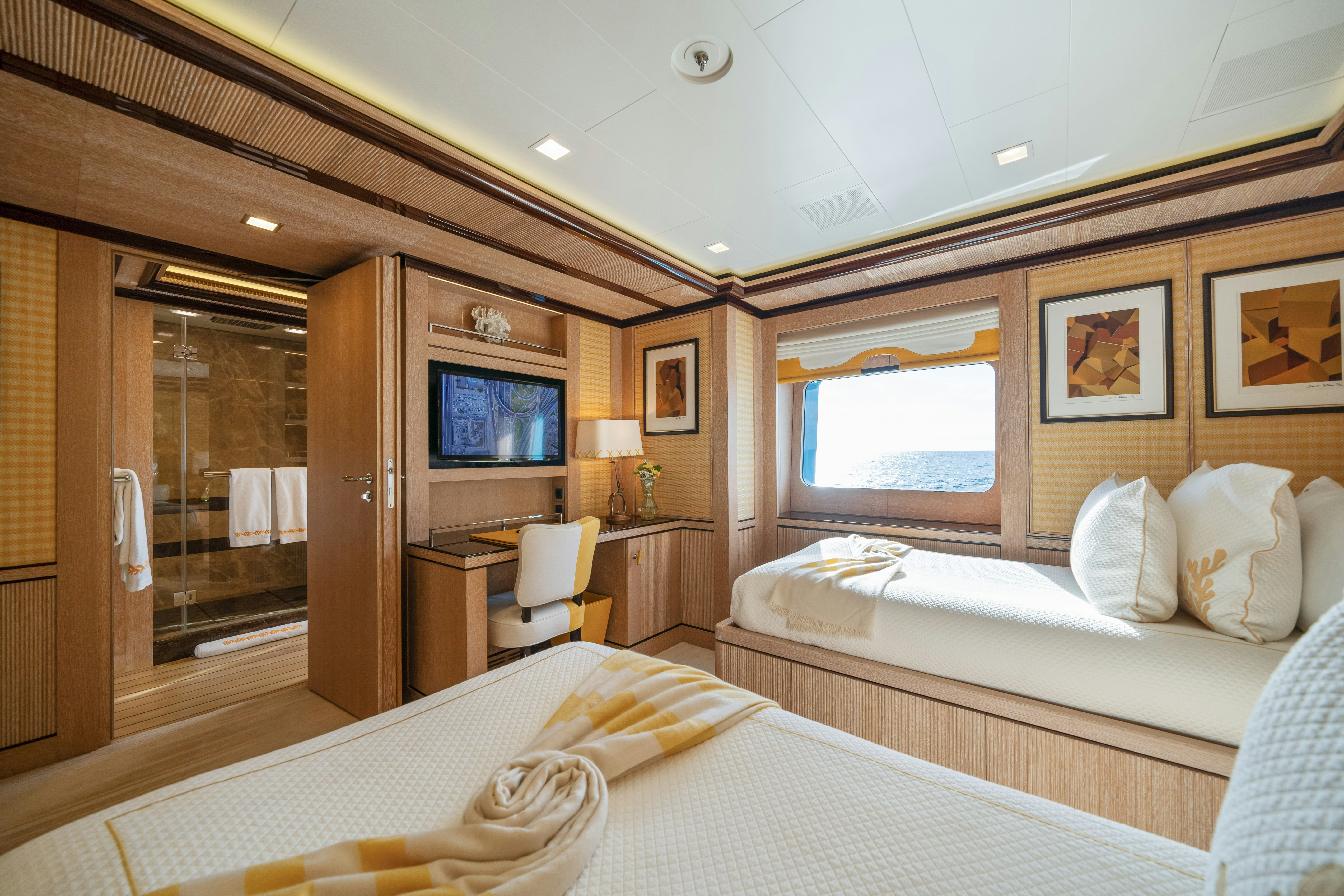 a hotel room with two beds aboard AXIOMA Yacht for Sale
