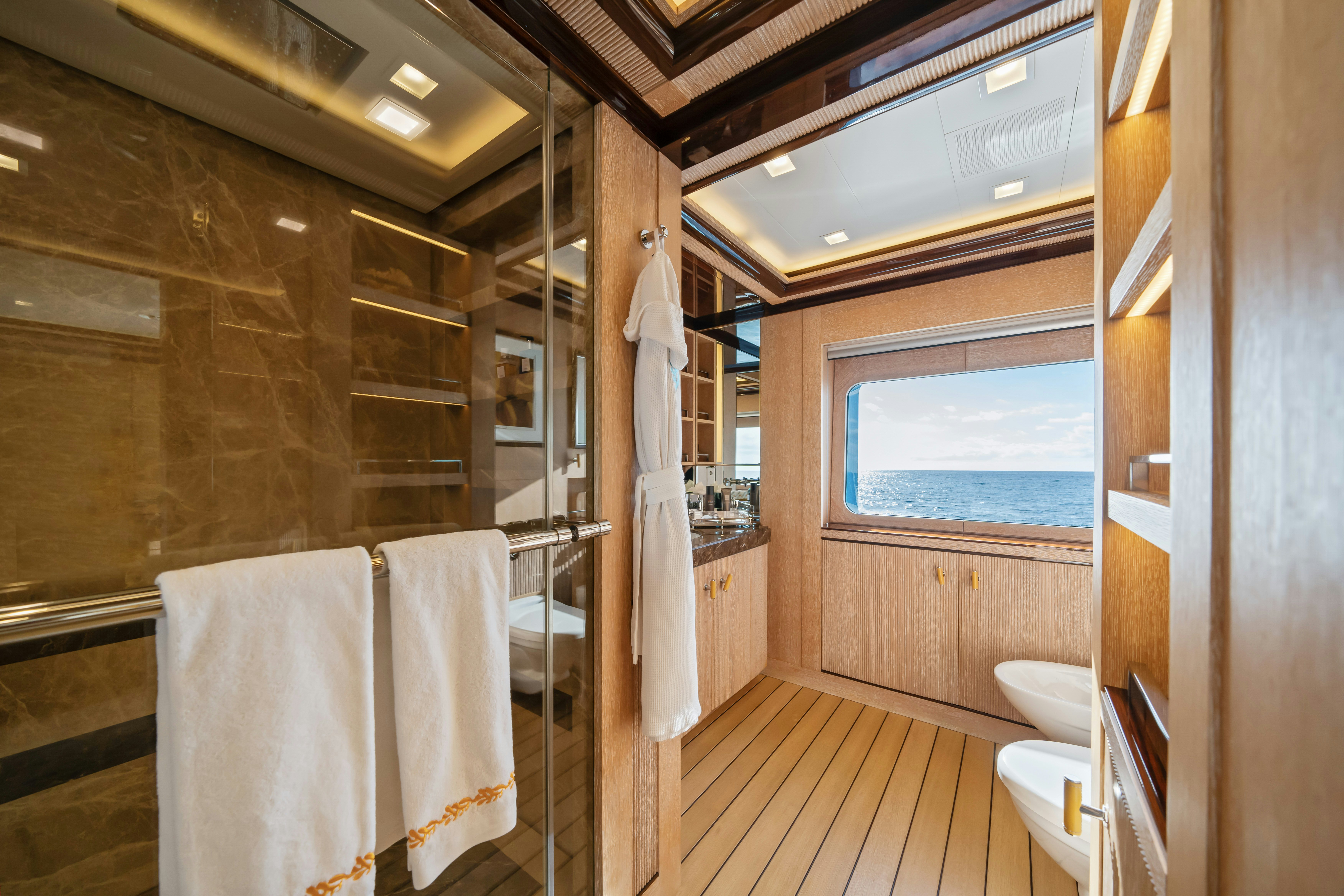 a bathroom with a shower unit and sink aboard AXIOMA Yacht for Sale