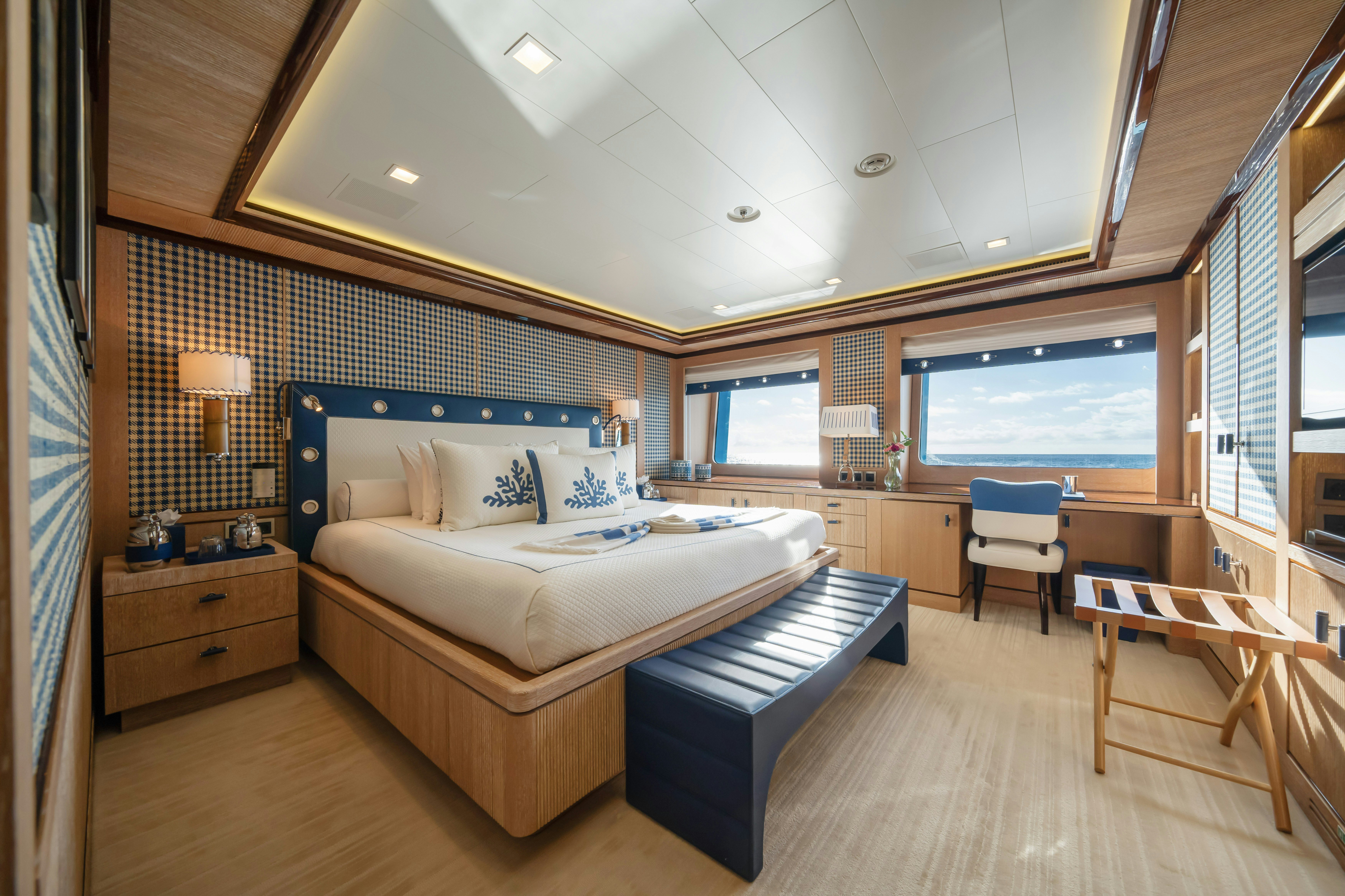 a bedroom with a large bed aboard AXIOMA Yacht for Sale