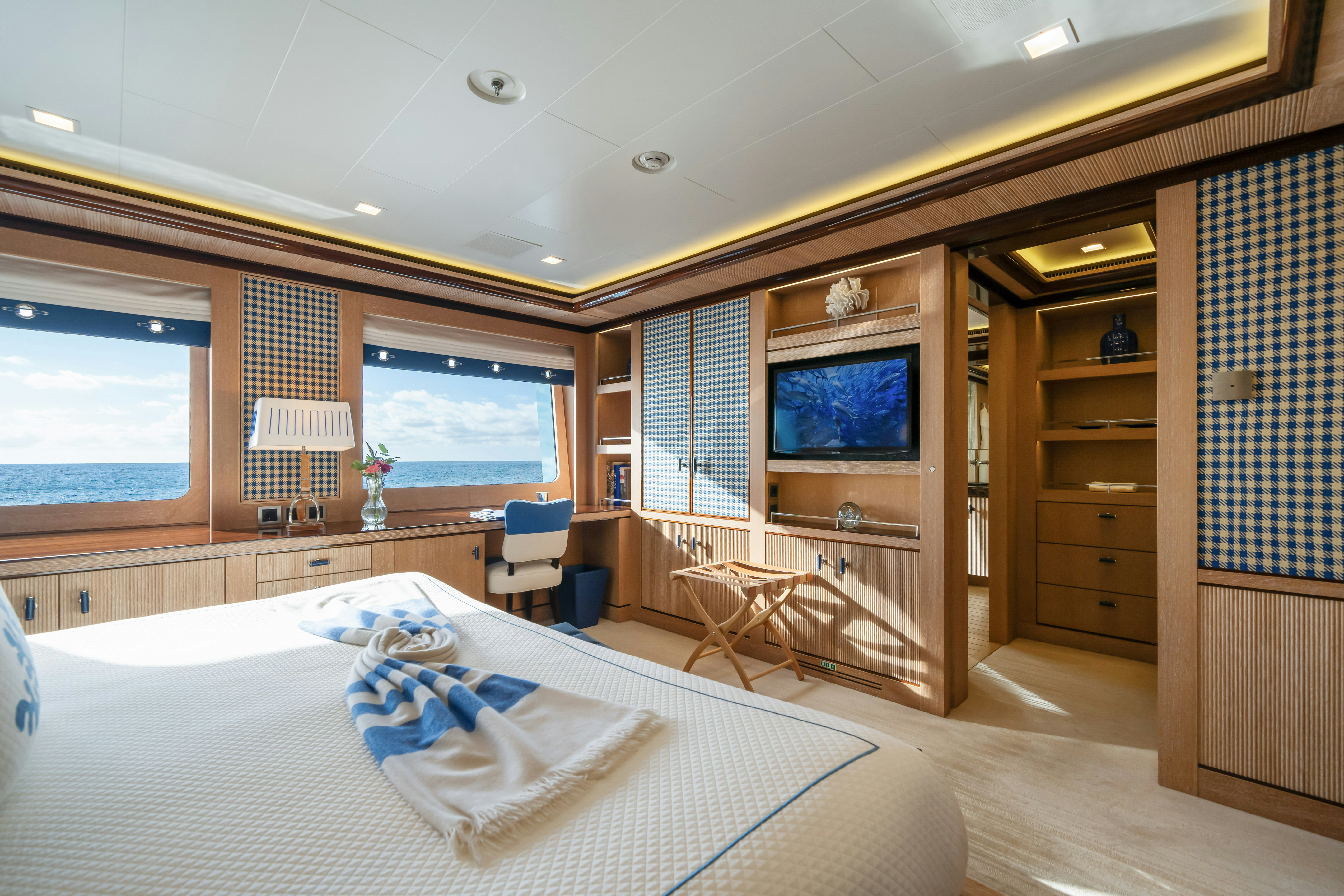 a bedroom with a large bed aboard AXIOMA Yacht for Sale