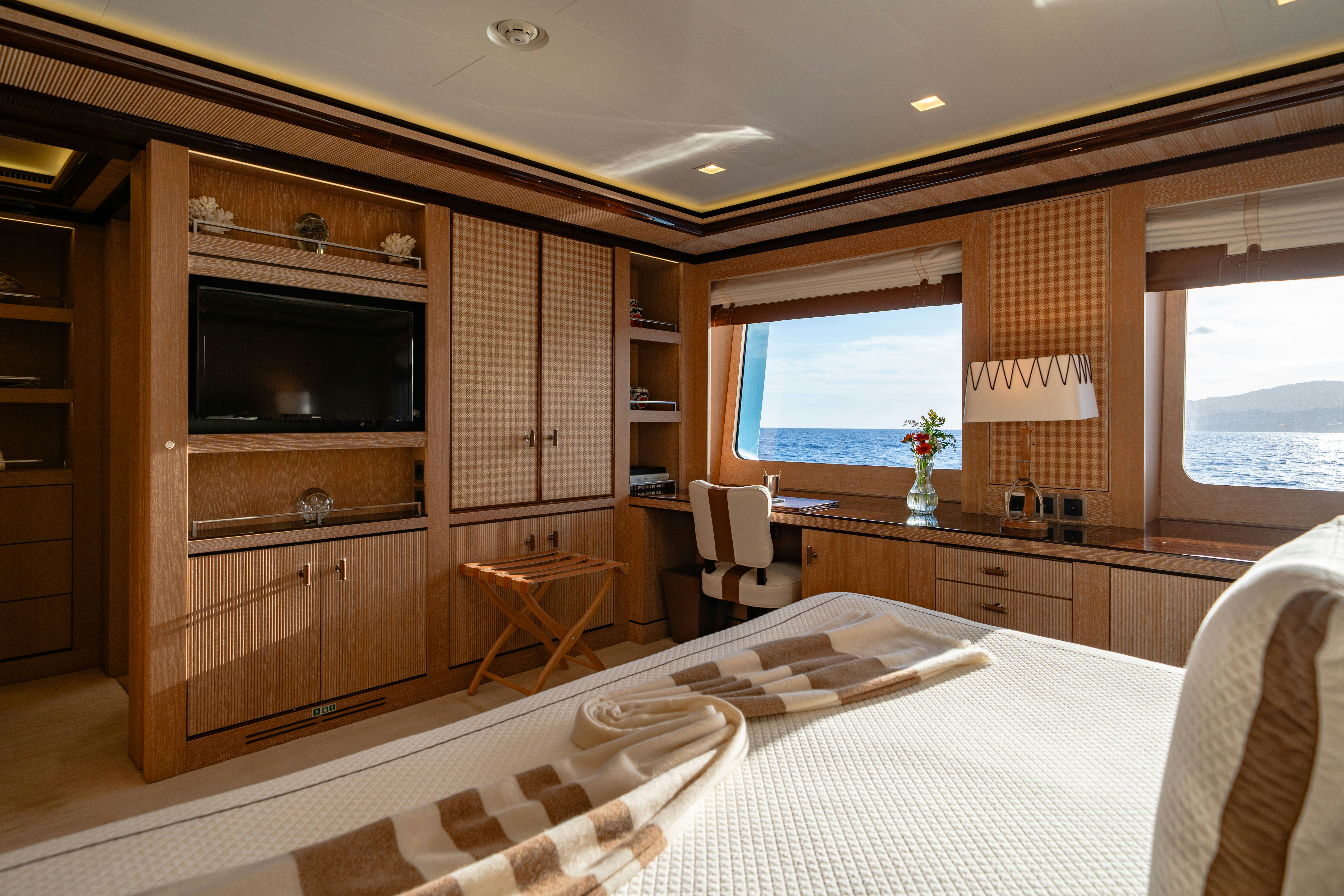 a large bedroom with a large bed aboard AXIOMA Yacht for Sale