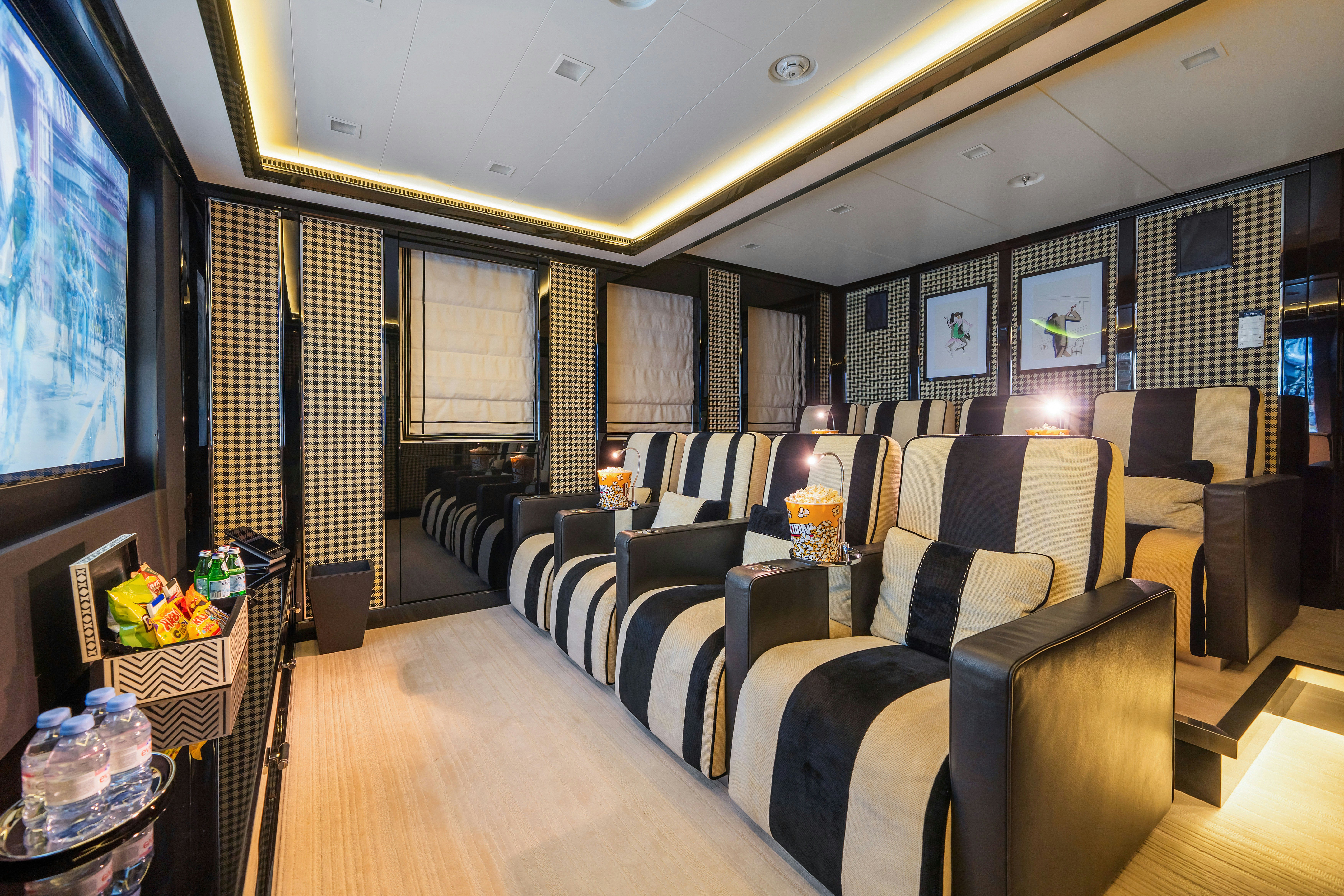a room with a couch and a table aboard AXIOMA Yacht for Sale