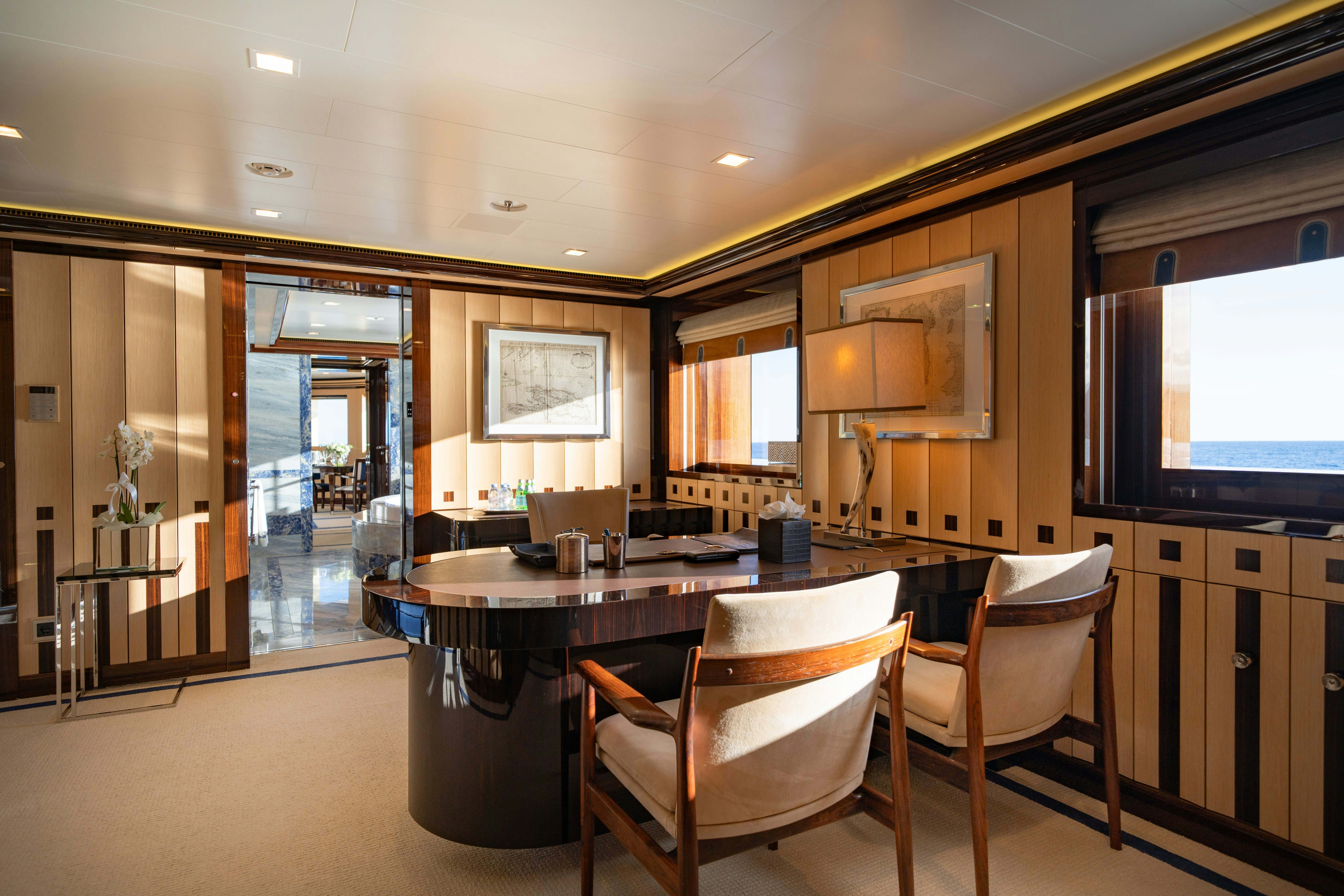 a large kitchen with a dining table aboard AXIOMA Yacht for Sale