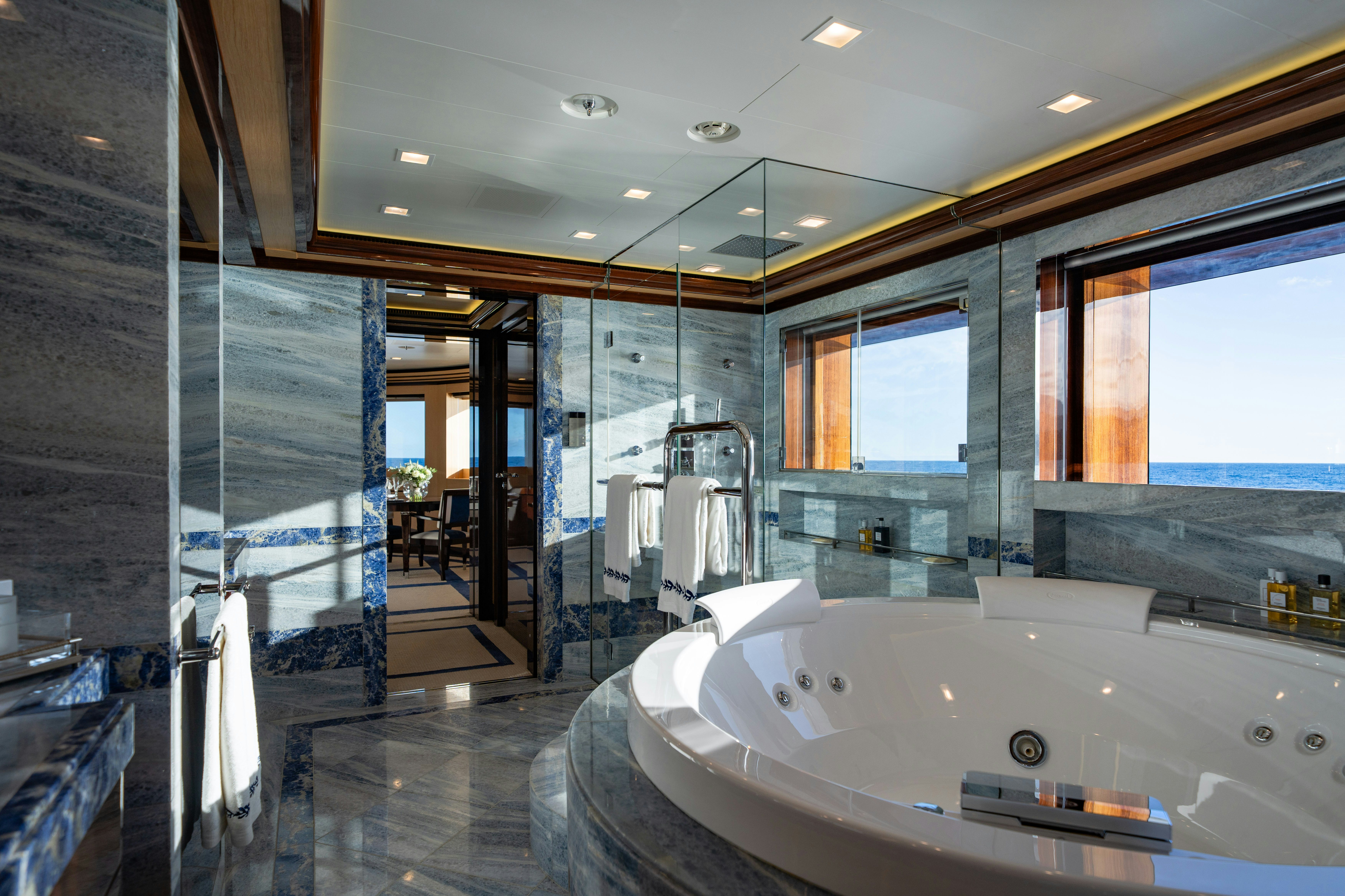 a large bathroom with a large tub aboard AXIOMA Yacht for Sale