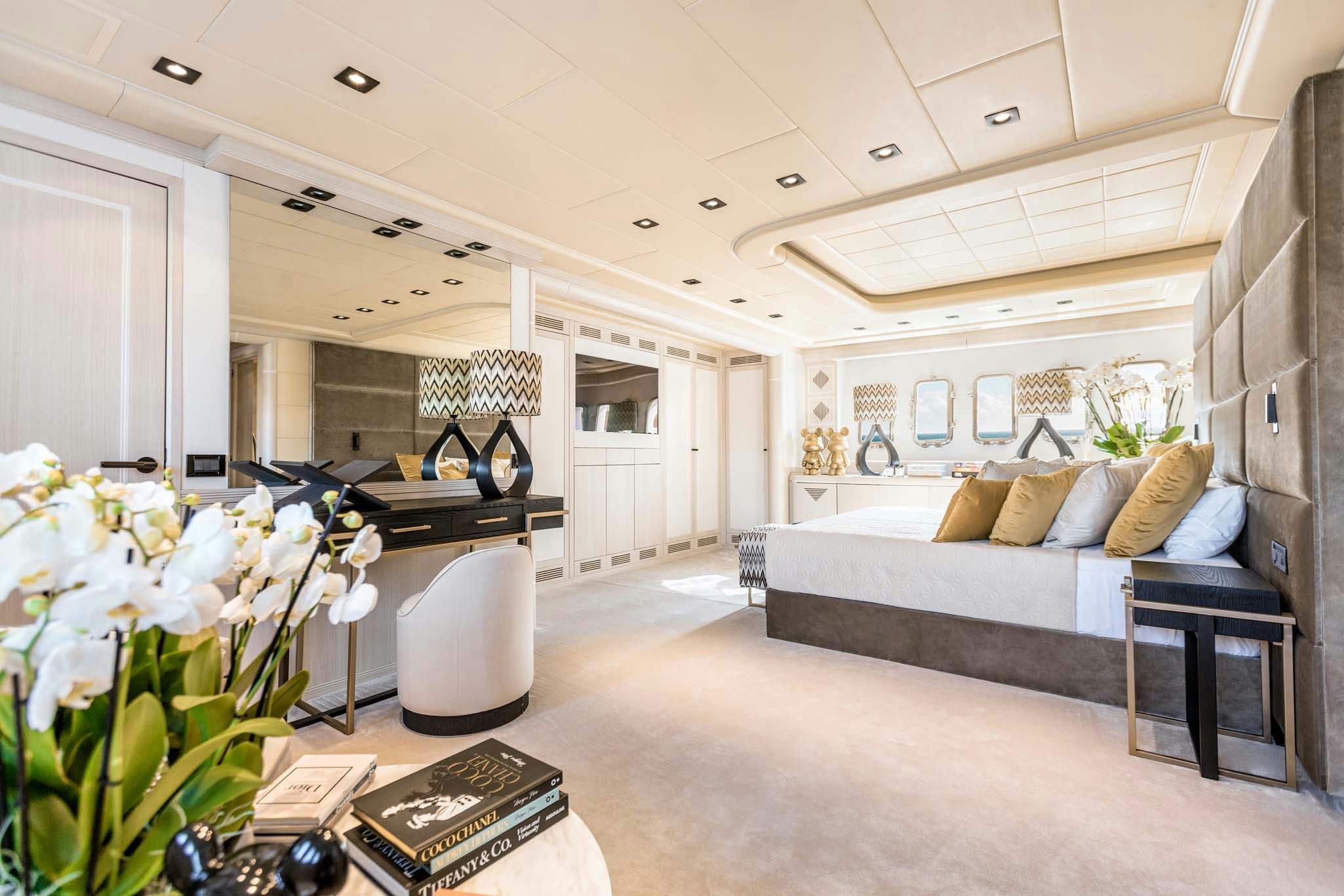 a living room with a couch and a piano aboard MRS GREY Yacht for Charter
