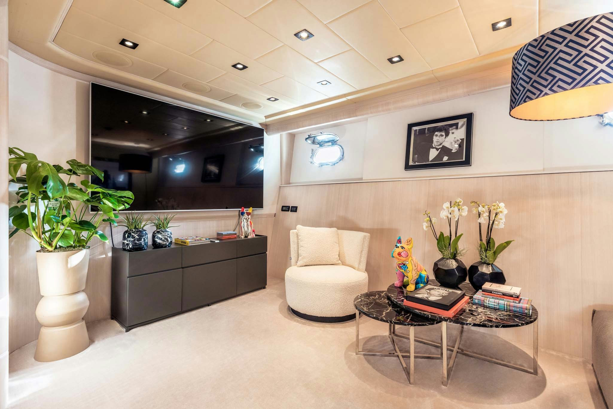a living room with a white couch and a coffee table aboard MRS GREY Yacht for Charter