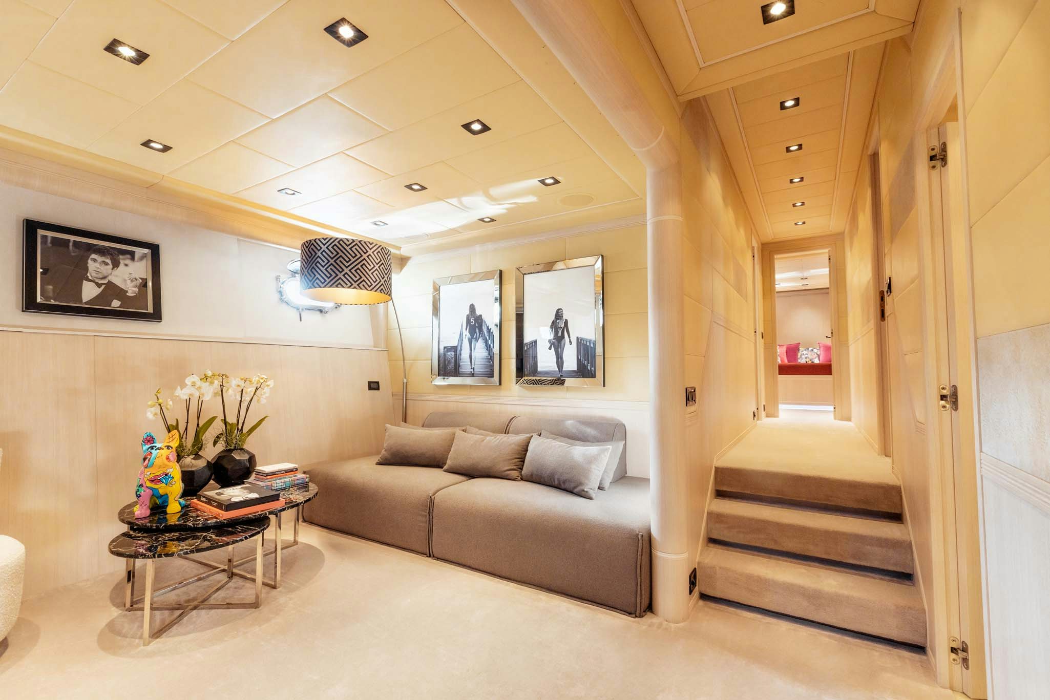 a living room with a couch and a coffee table aboard MRS GREY Yacht for Charter