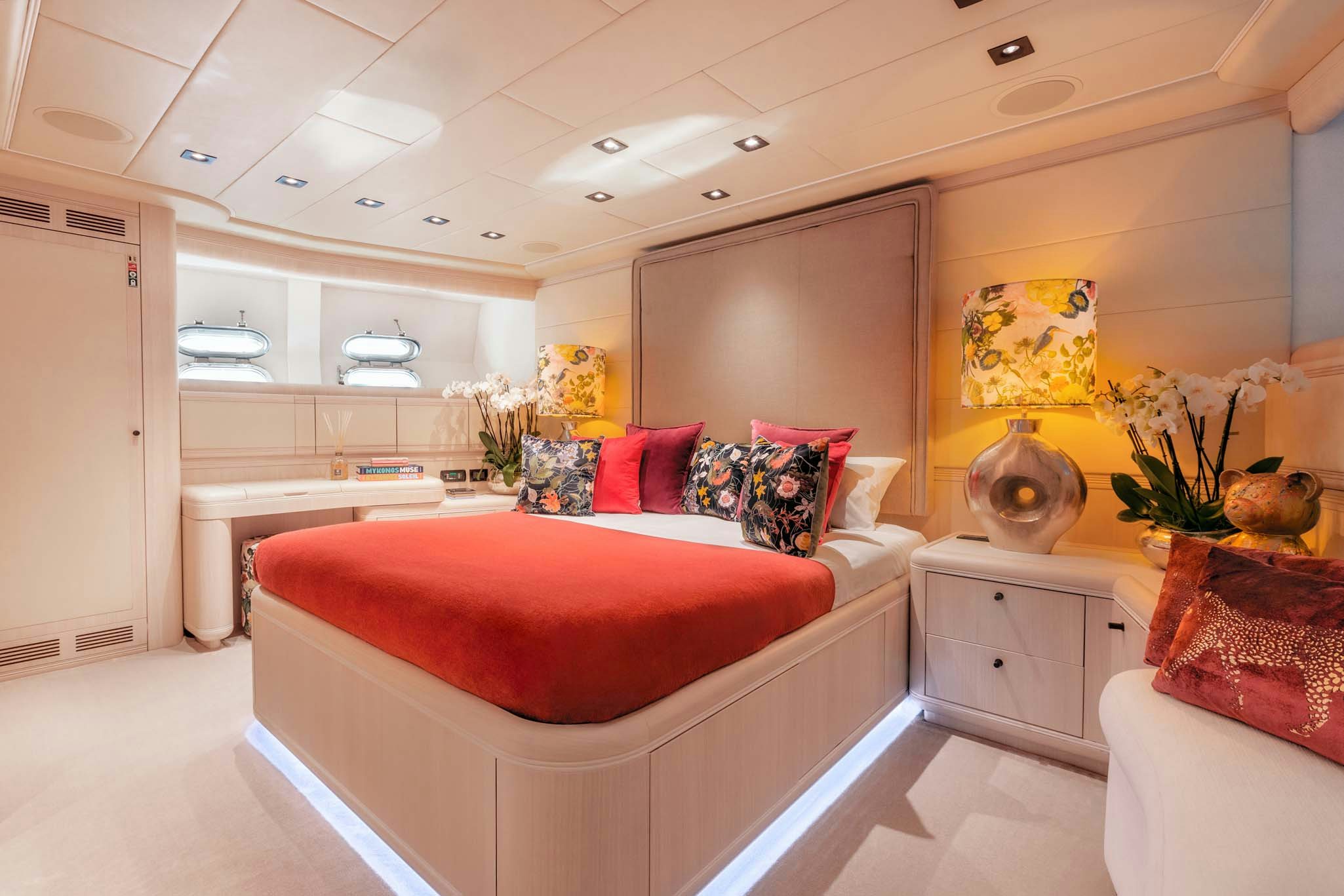 a bedroom with a bed and a desk aboard MRS GREY Yacht for Charter