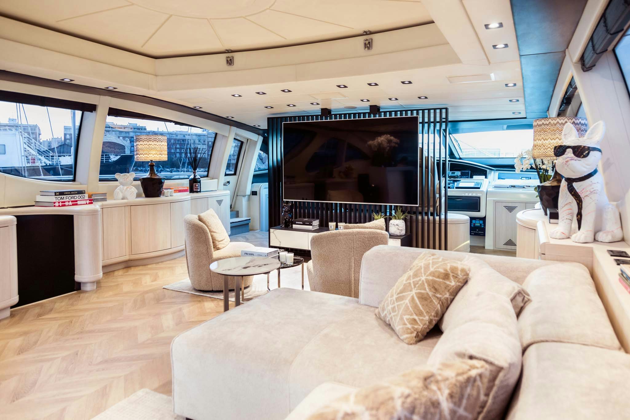 a living room with a large screen aboard MRS GREY Yacht for Charter