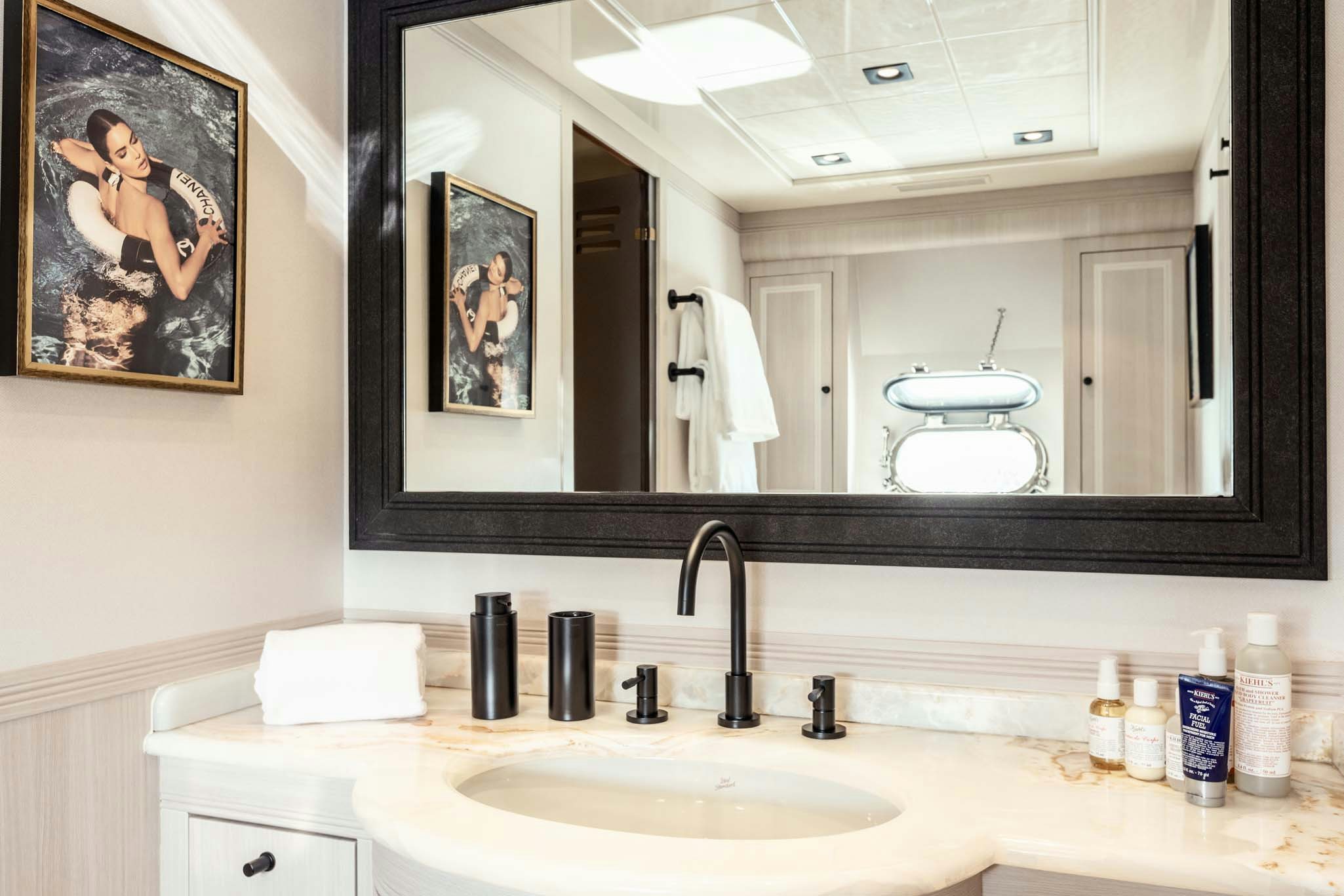 a bathroom with a large mirror aboard MRS GREY Yacht for Charter