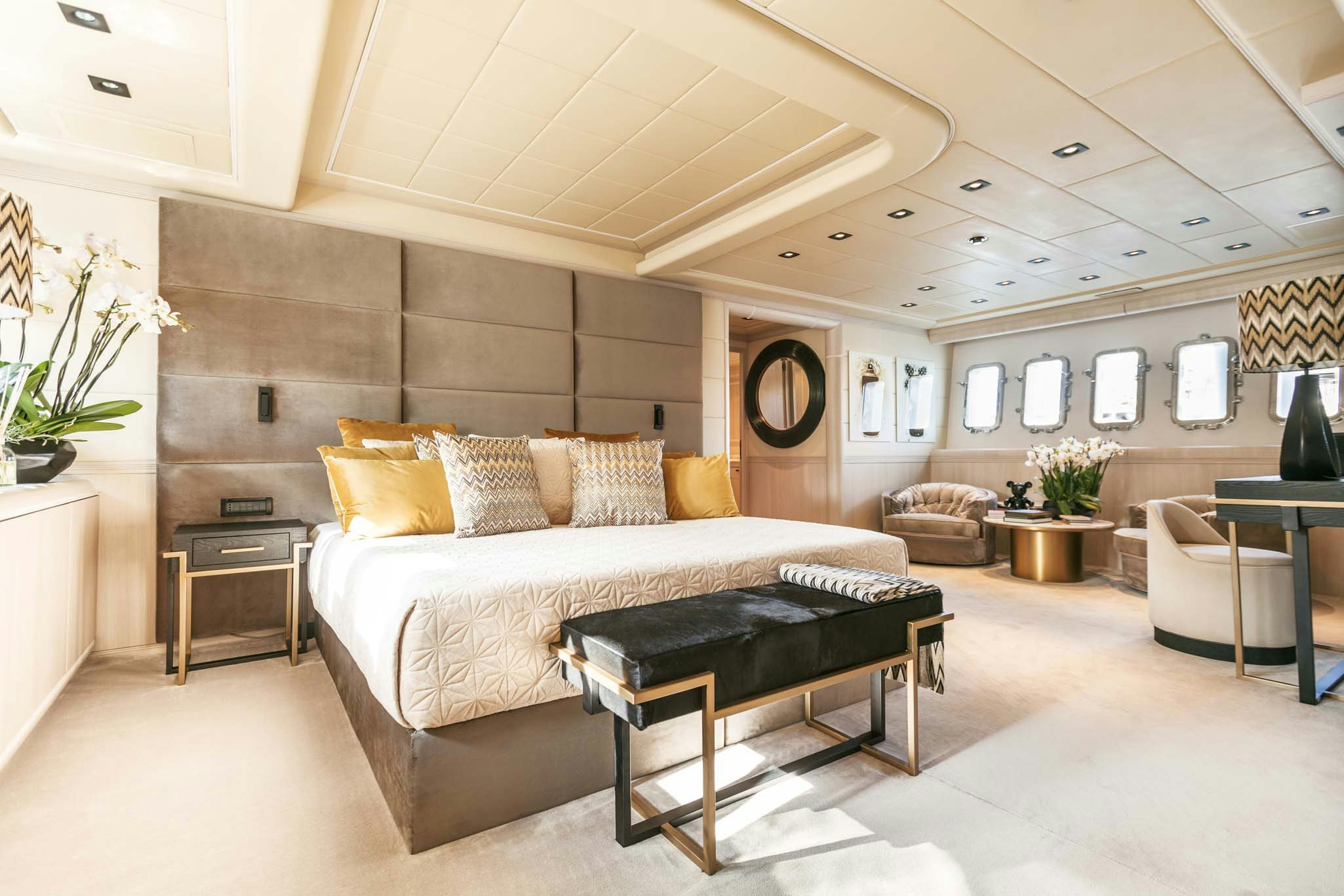 a large bed in a room aboard MRS GREY Yacht for Charter