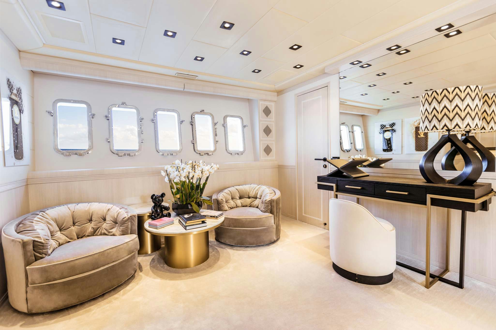 a living room with a couch and a table aboard MRS GREY Yacht for Charter