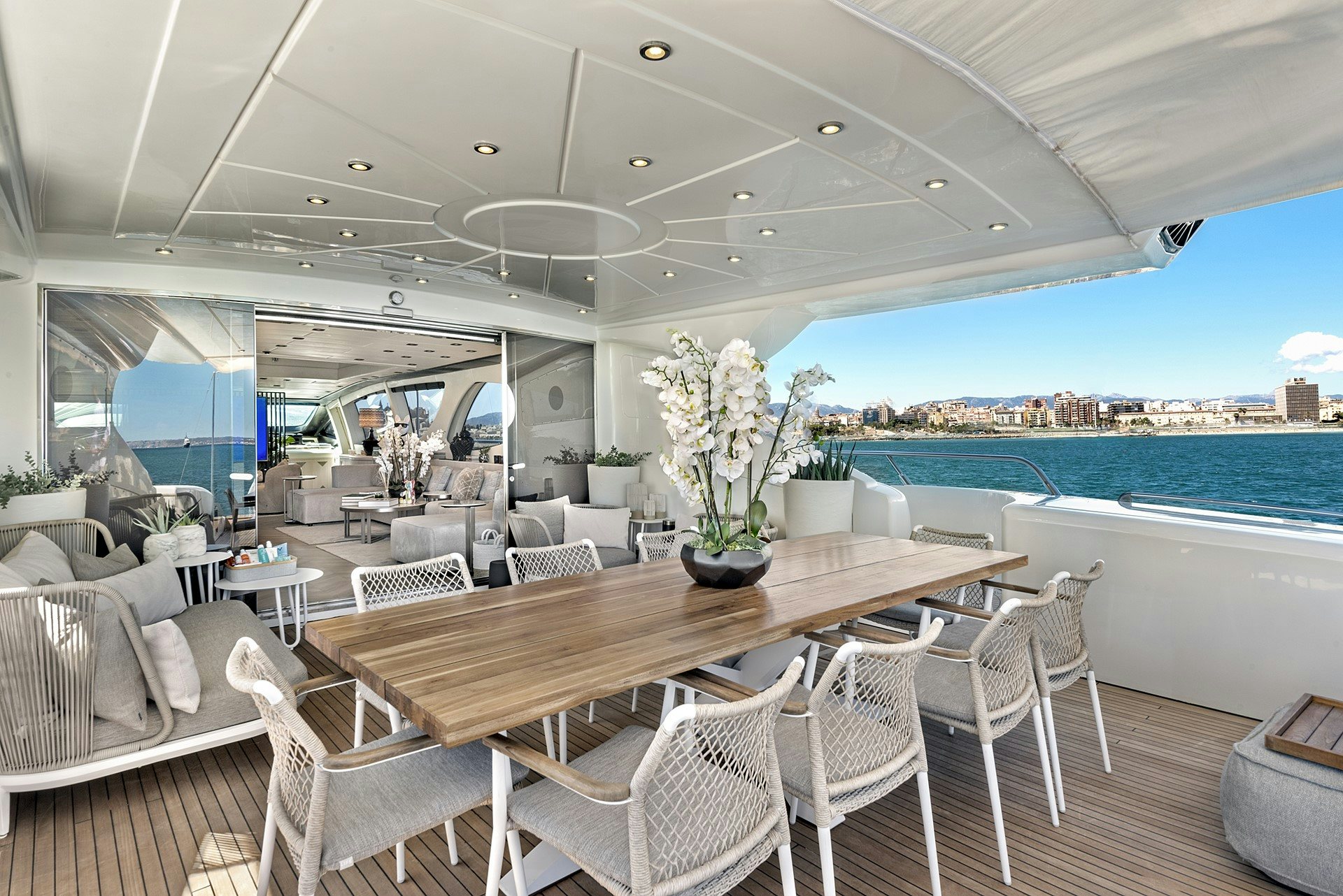 a table and chairs on a boat aboard MRS GREY Yacht for Charter