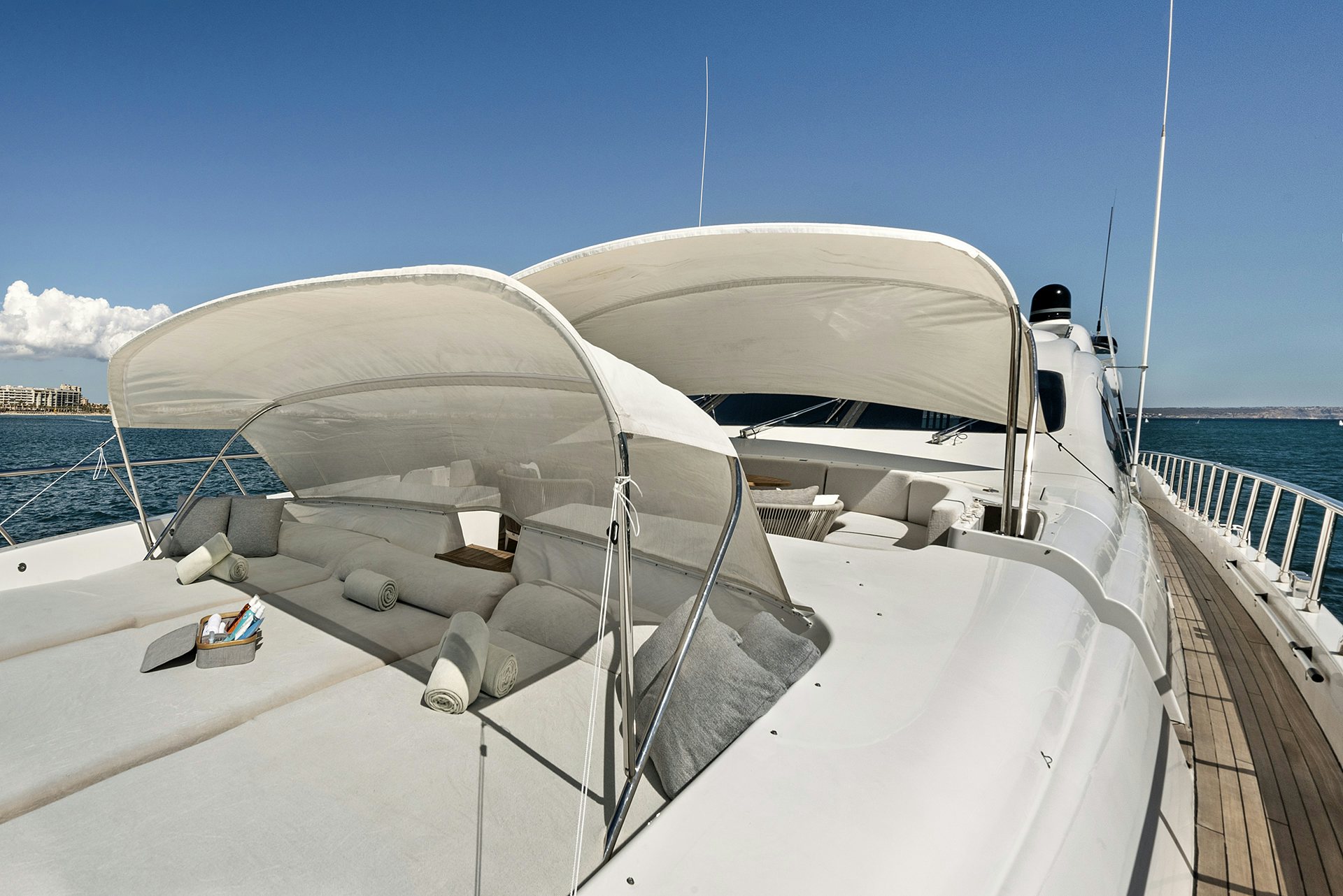 a white boat on a dock aboard MRS GREY Yacht for Charter