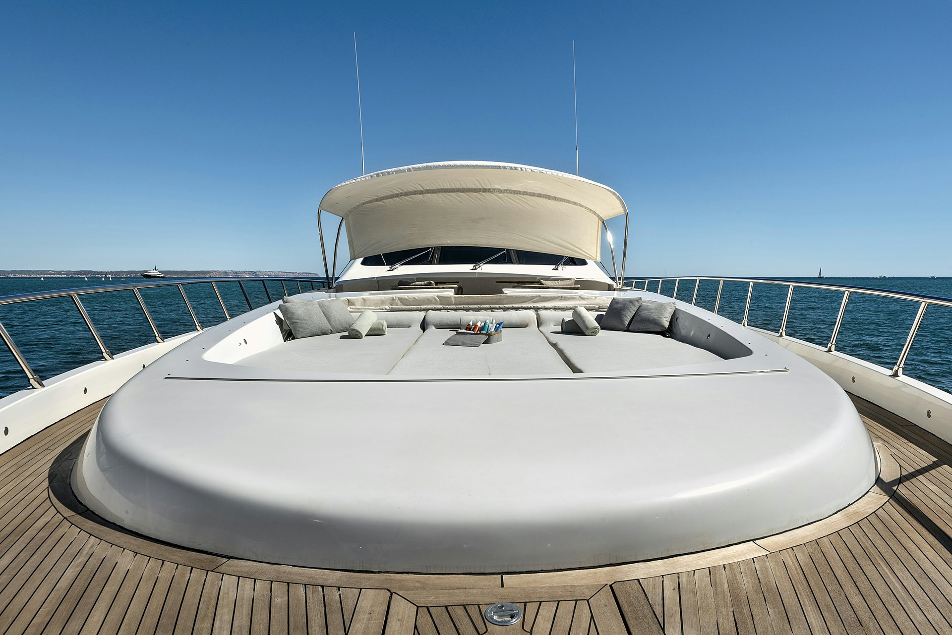 a white boat on a deck aboard MRS GREY Yacht for Charter