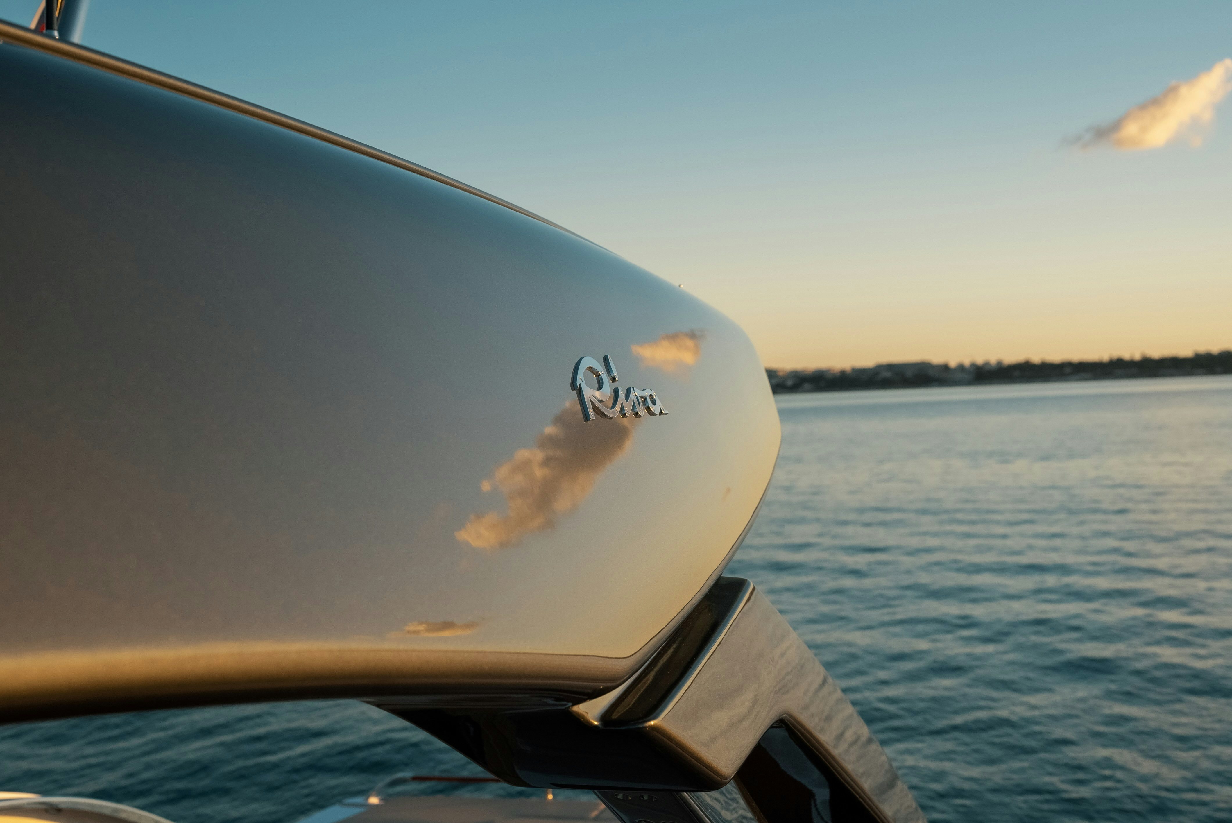 a person's hand on a steering wheel of a boat aboard DIABLE Yacht for Sale