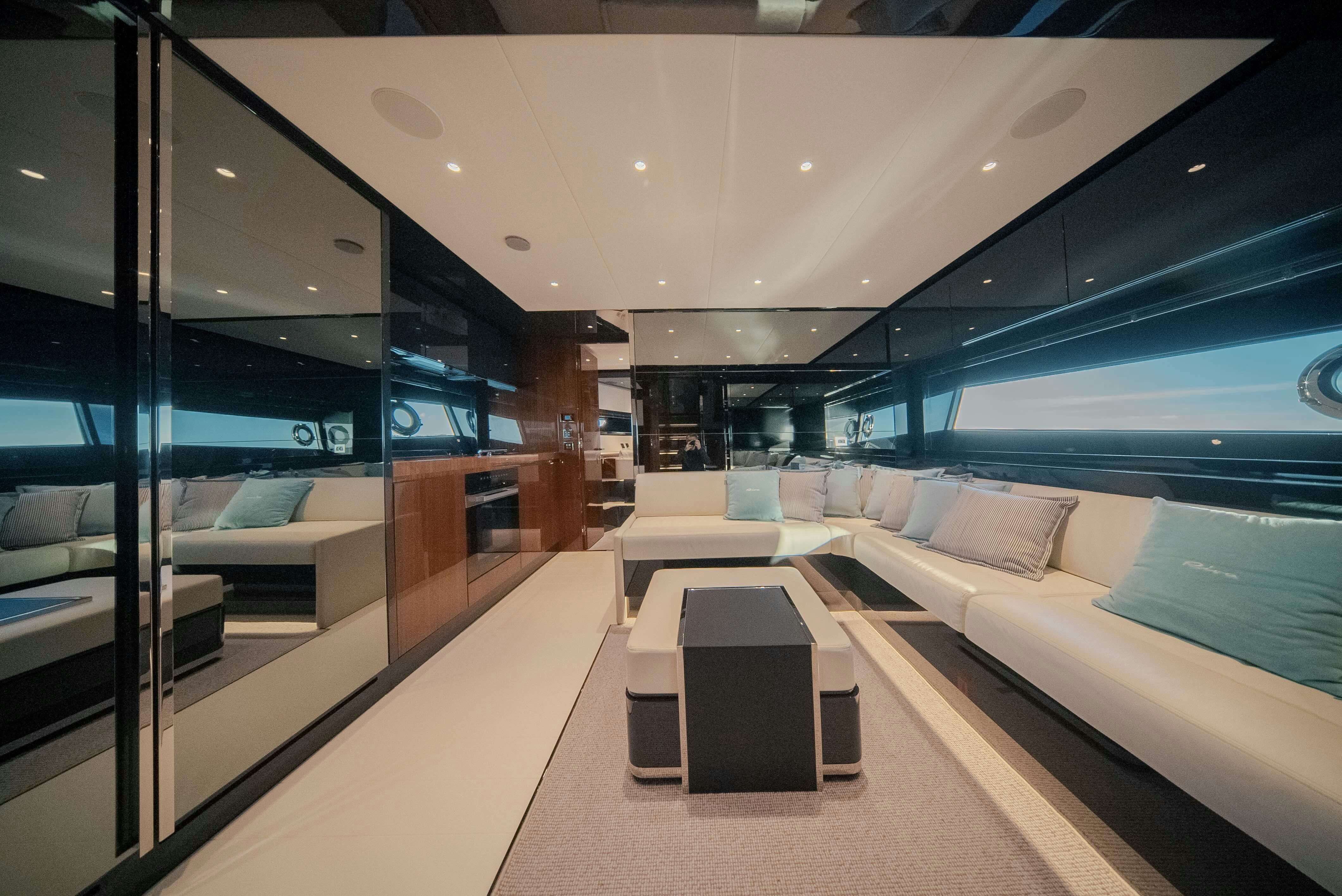 a room with a couch and a table aboard DIABLE Yacht for Sale