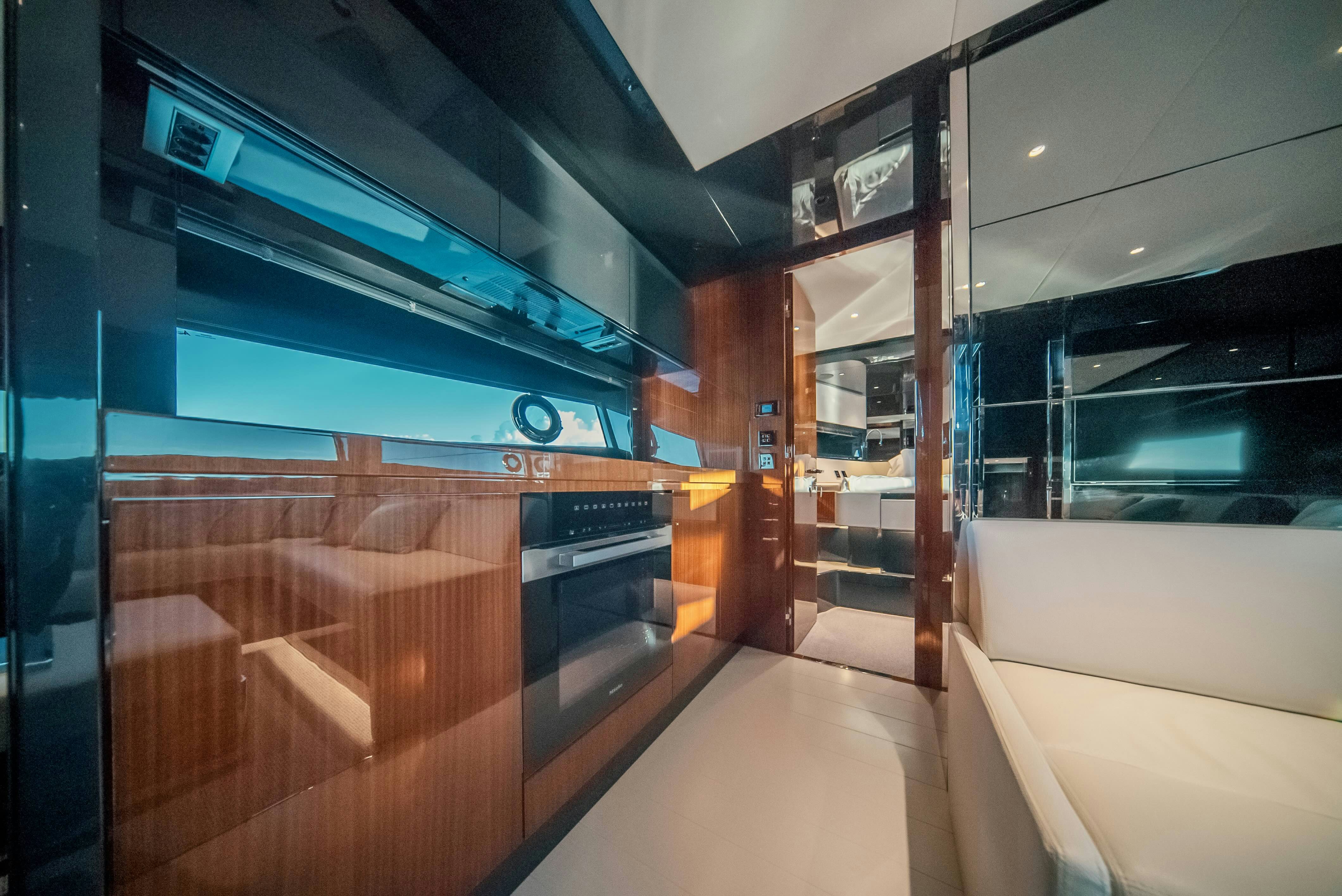 a room with a couch and a television aboard DIABLE Yacht for Sale