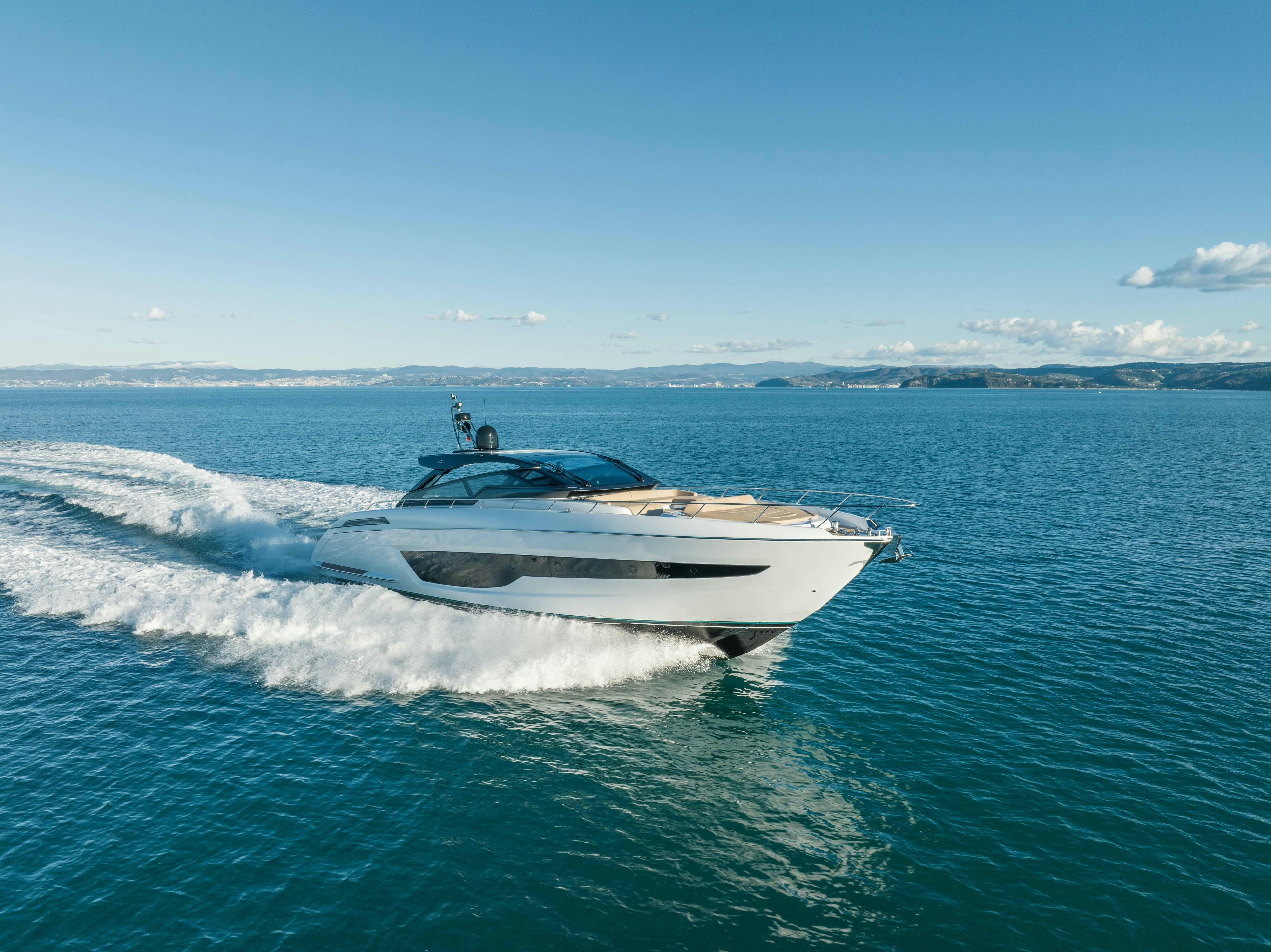 a white boat on water aboard DIABLE Yacht for Sale