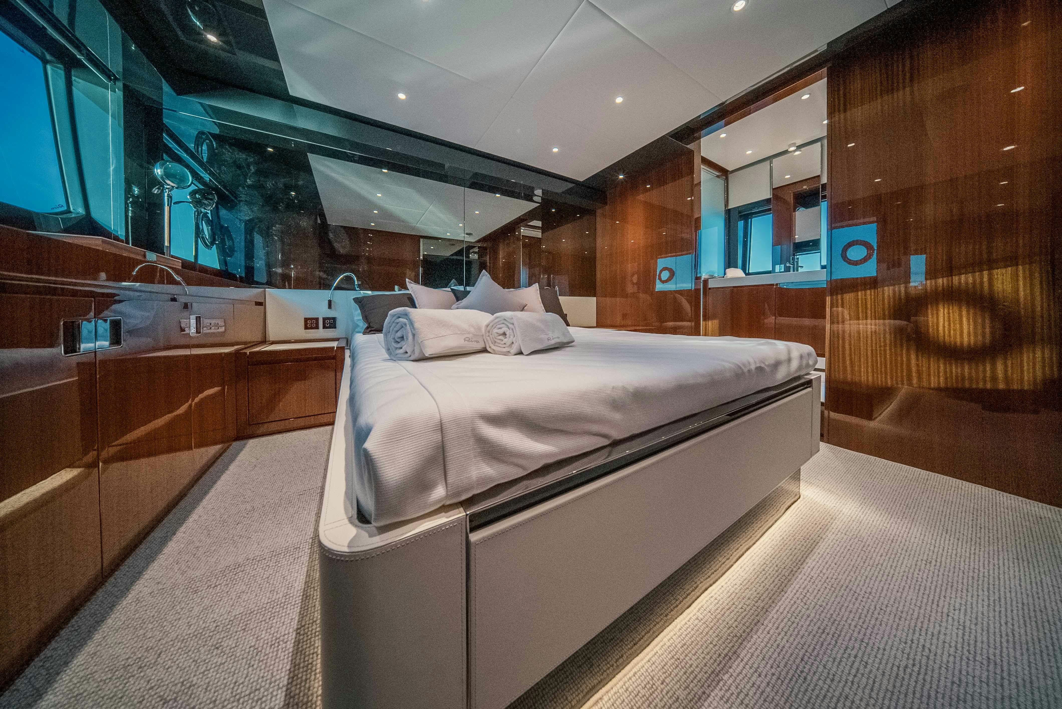a room with a bed and a window aboard DIABLE Yacht for Sale