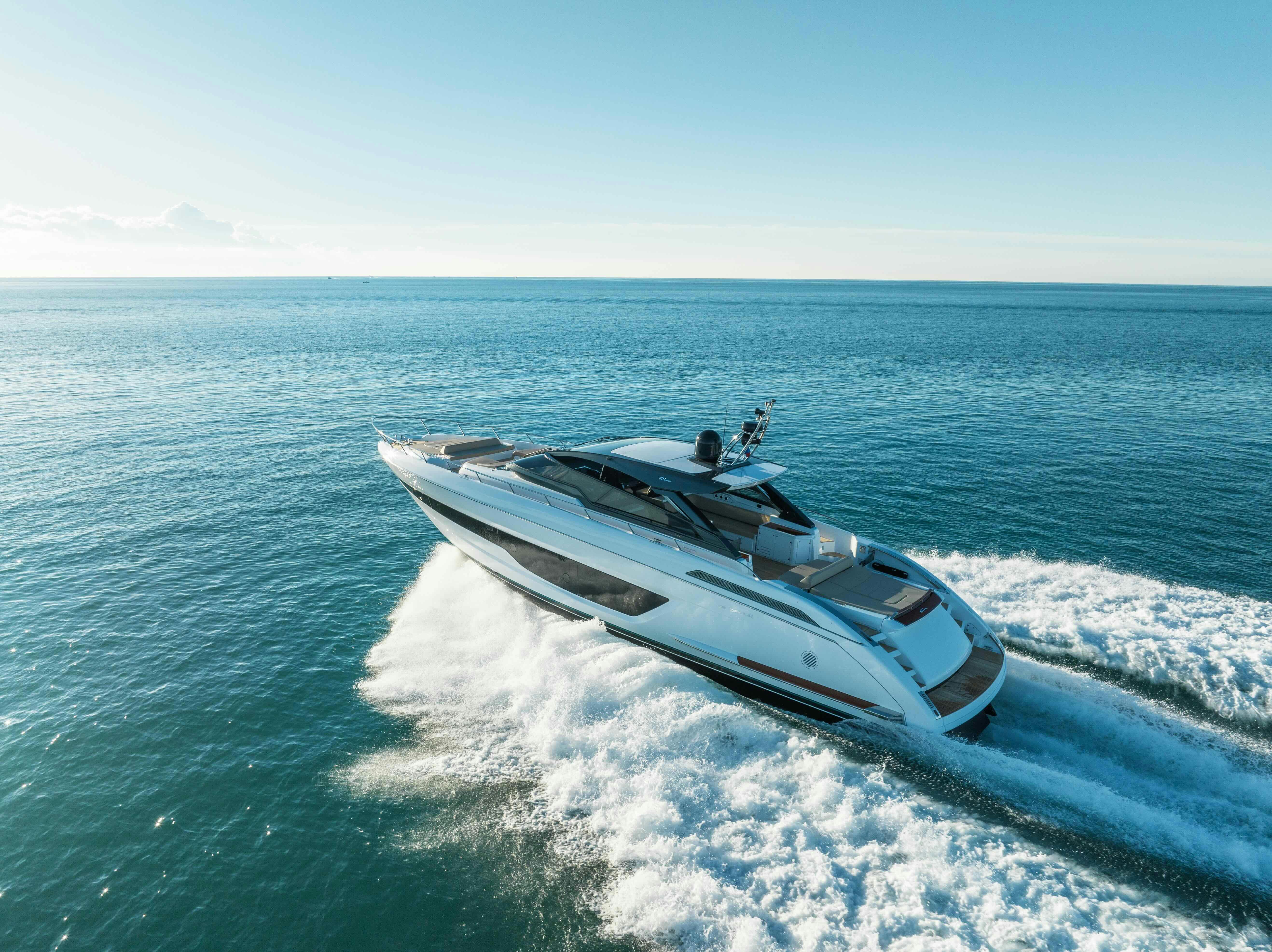 a white yacht in the water aboard DIABLE Yacht for Sale