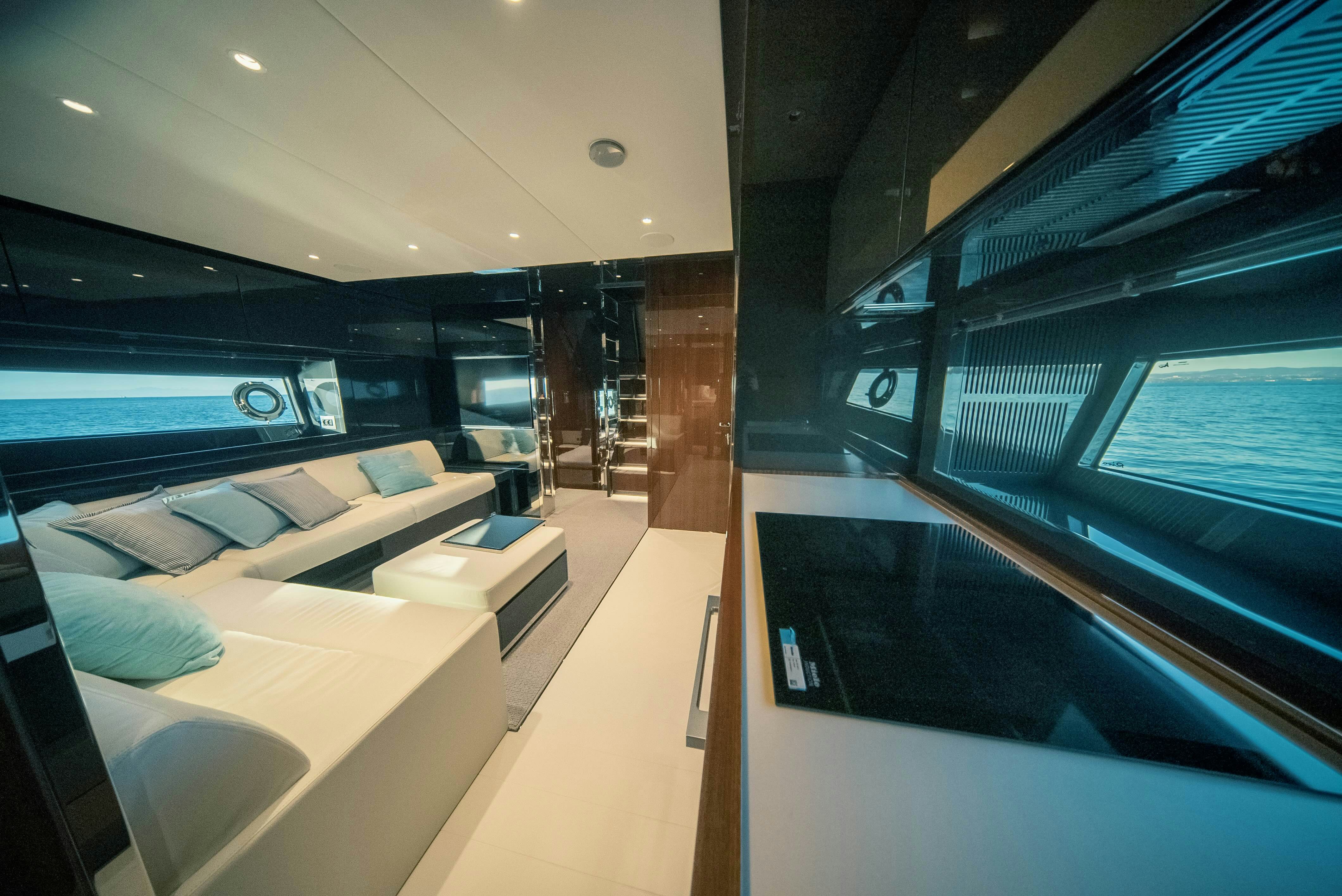 a room with a bed and a large window aboard DIABLE Yacht for Sale
