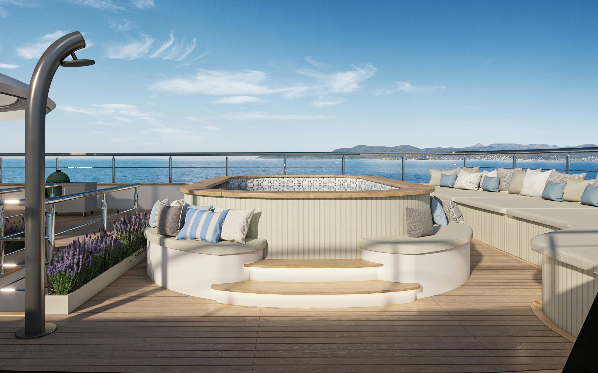 a deck with a large body of water and a large white sofa aboard BELLA Yacht for Charter