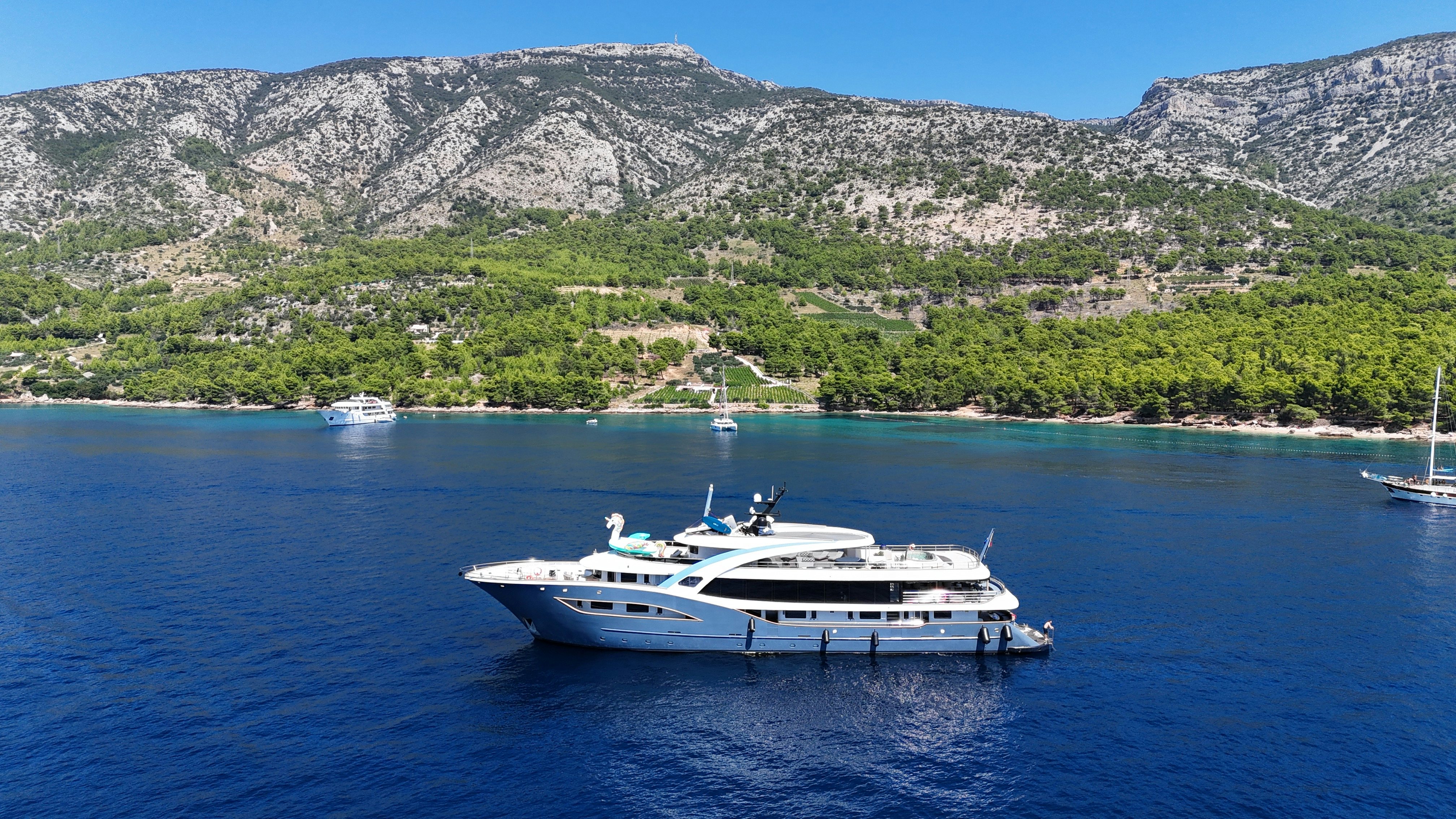 a group of boats in the water aboard BELLA Yacht for Charter