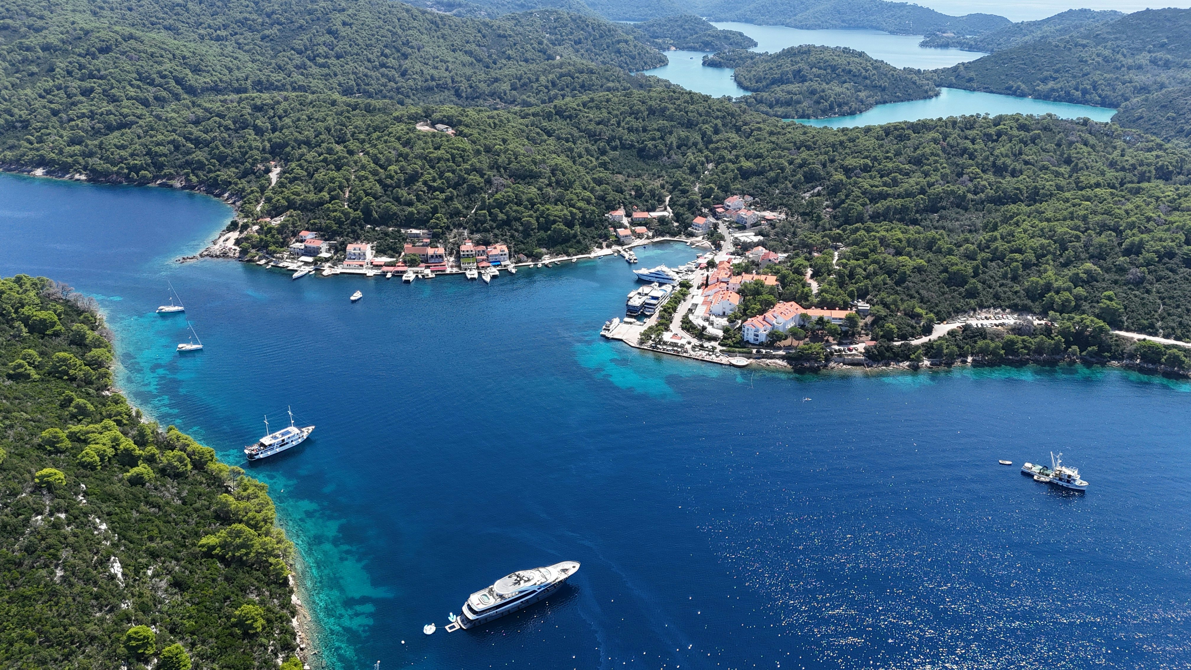 a bay with boats and houses aboard BELLA Yacht for Charter