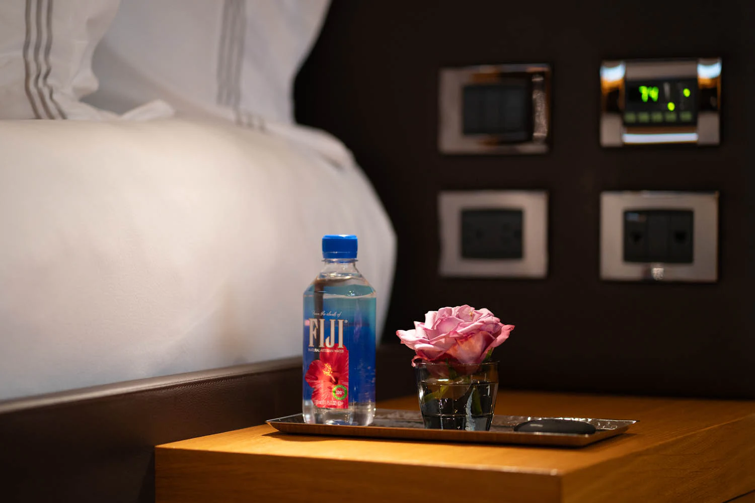 a bottle of water on a table aboard LUNA ROSSA Yacht for Charter
