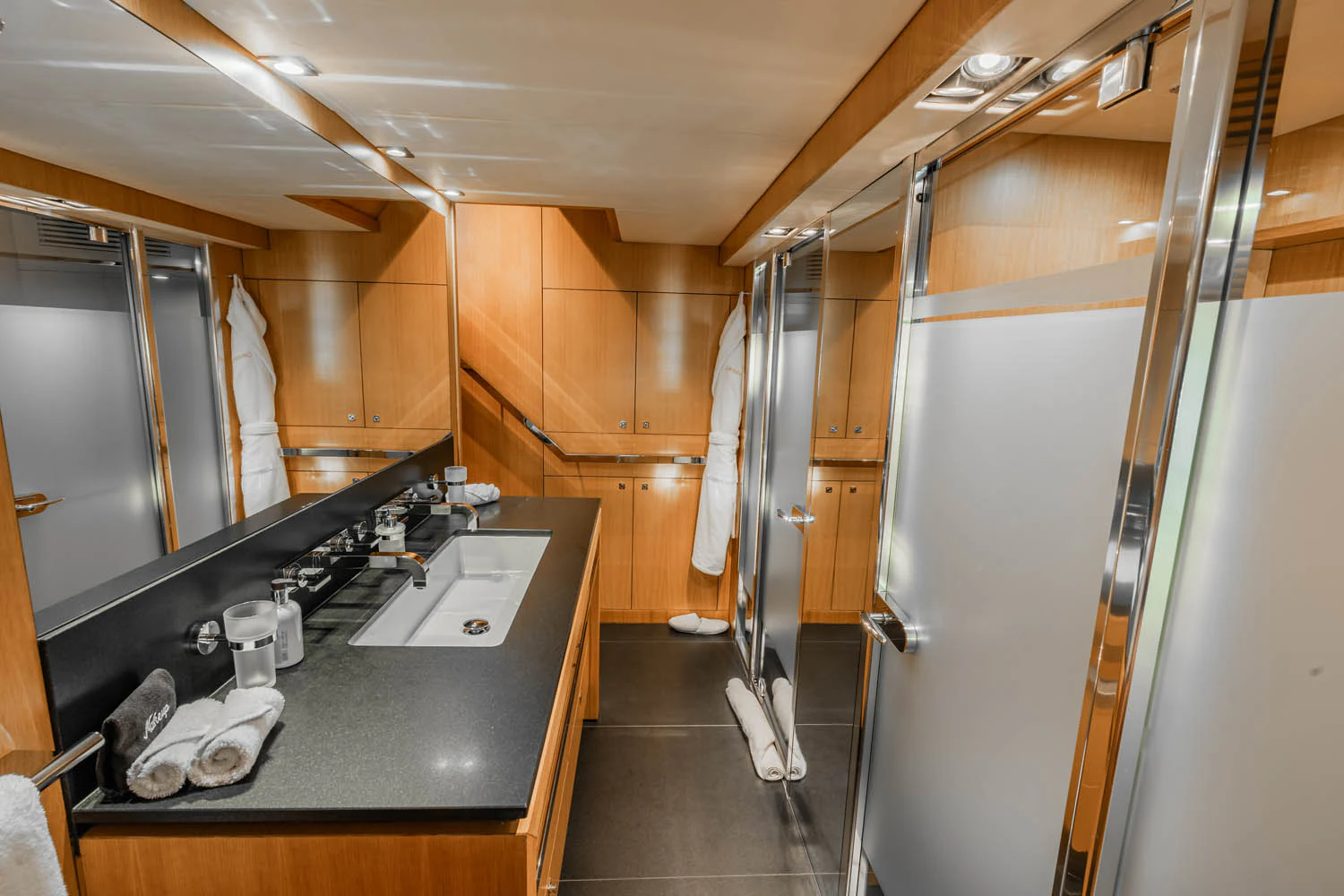 a kitchen with a countertop sink and cabinets aboard LUNA ROSSA Yacht for Charter
