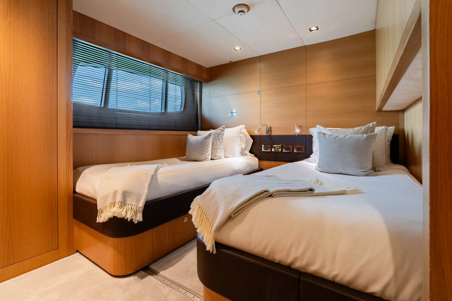 a room with two beds aboard LUNA ROSSA Yacht for Charter