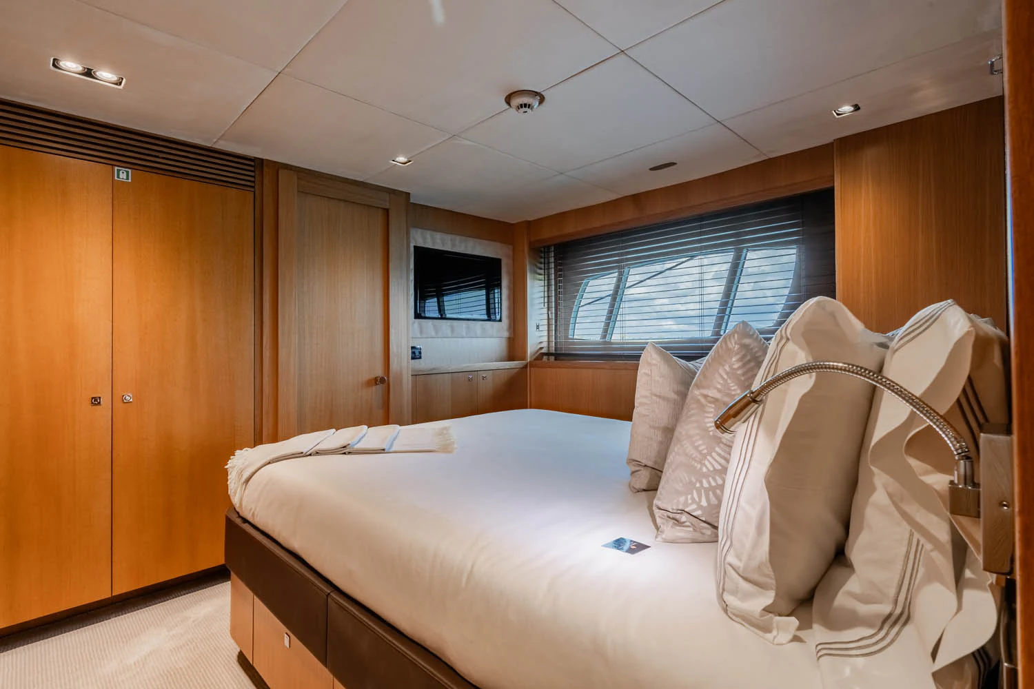 a bed in a cabin aboard LUNA ROSSA Yacht for Charter