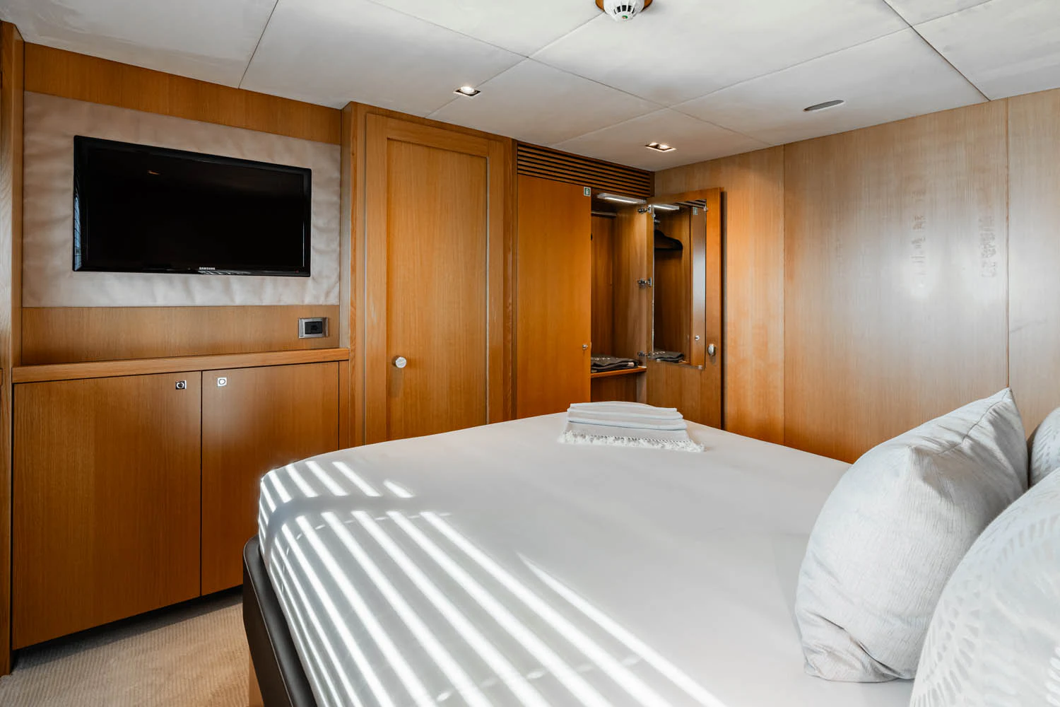 a bed in a room aboard LUNA ROSSA Yacht for Charter