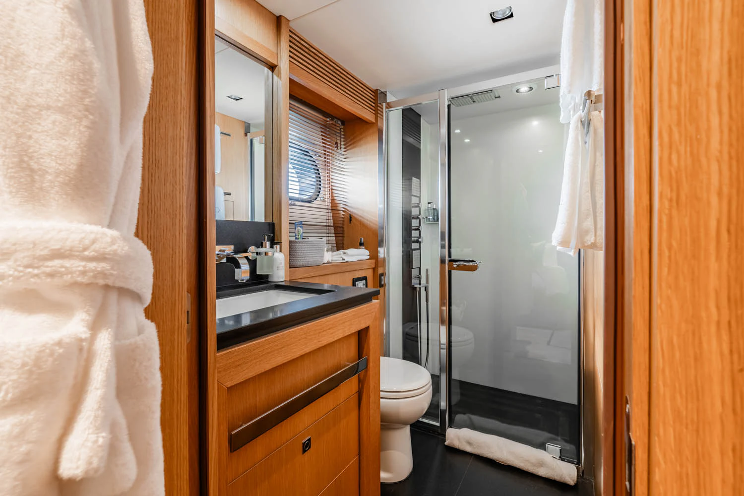 a bathroom with a sink and toilet aboard LUNA ROSSA Yacht for Charter