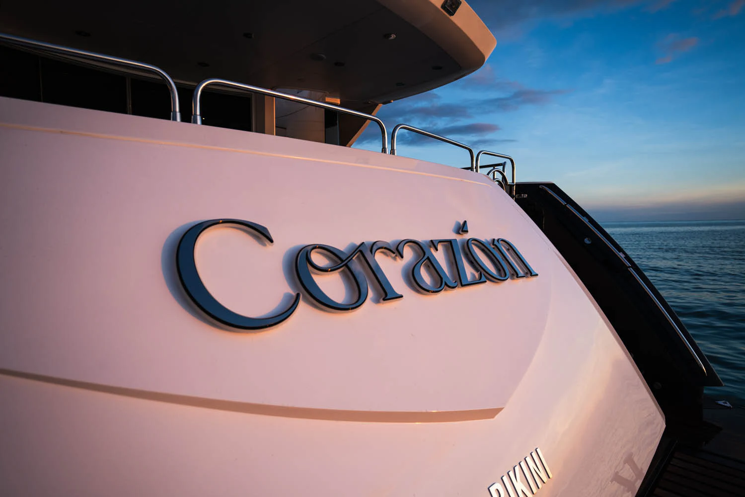 the side of a boat aboard LUNA ROSSA Yacht for Charter