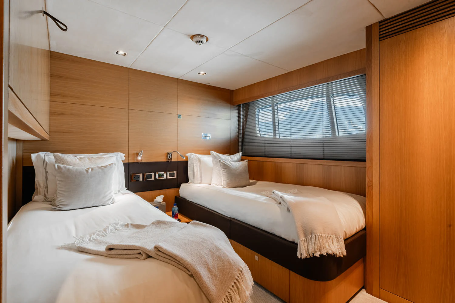 a room with two beds aboard LUNA ROSSA Yacht for Charter