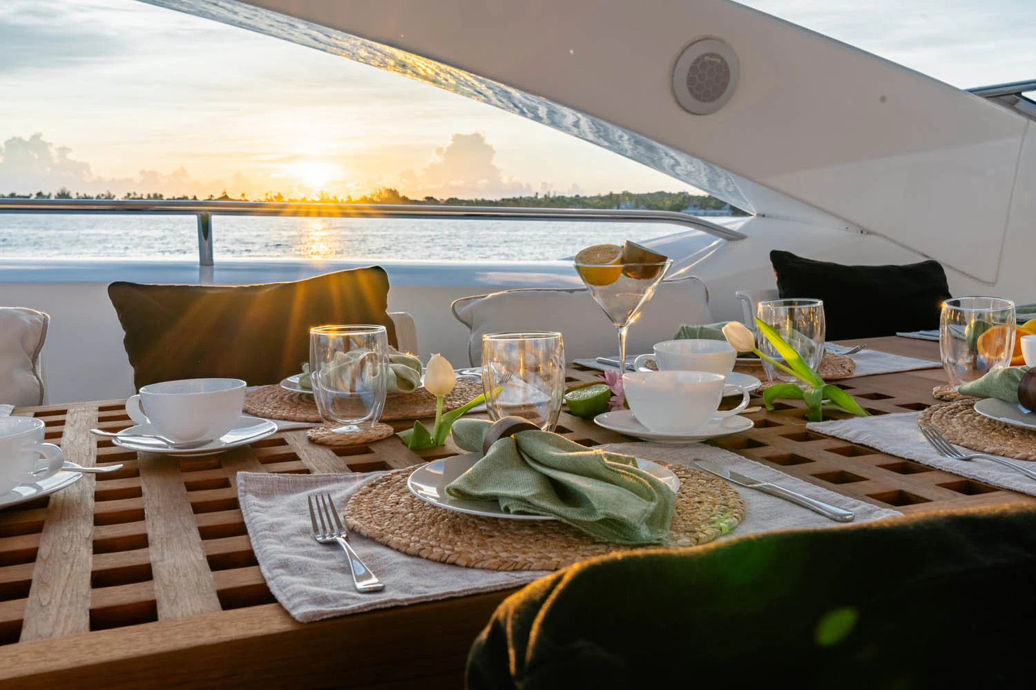 a table with food and glasses on it aboard LUNA ROSSA Yacht for Charter