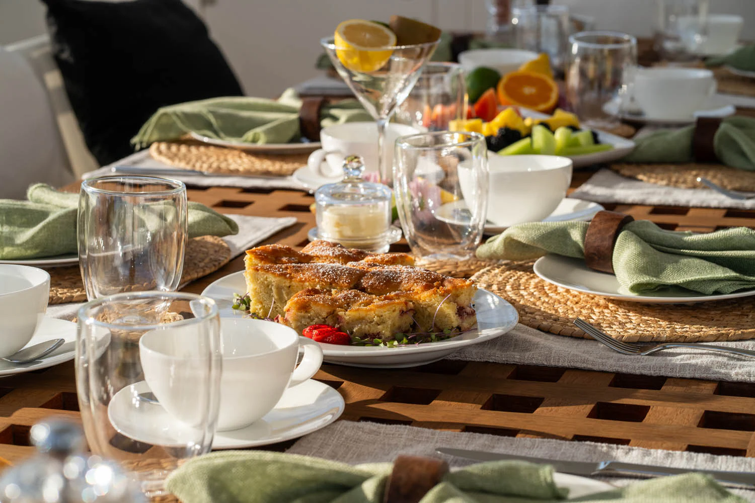 a table with plates and glasses aboard LUNA ROSSA Yacht for Charter