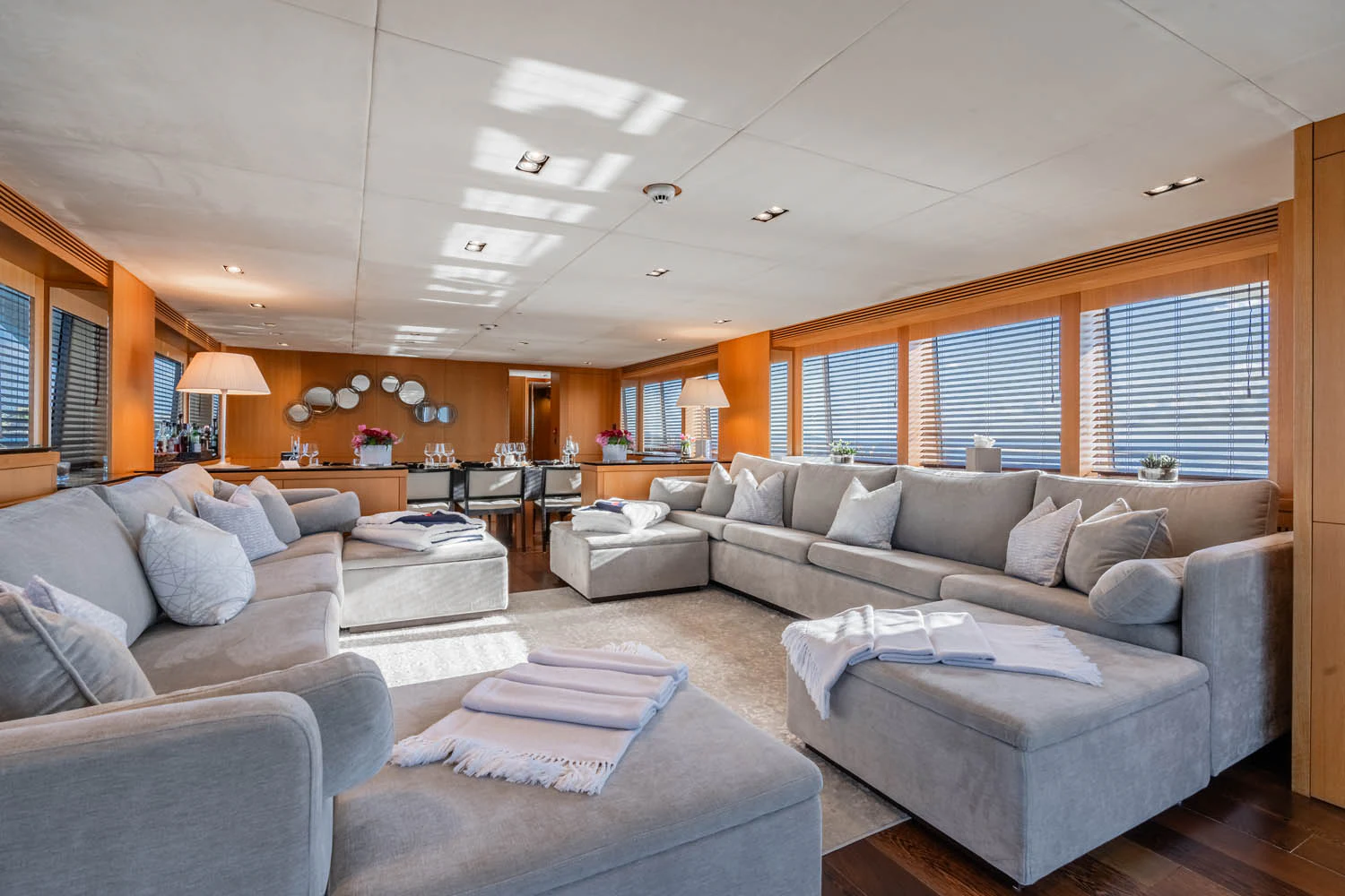 a living room with a couch and a table aboard LUNA ROSSA Yacht for Charter
