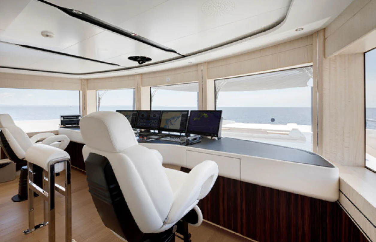 a room with a desk and chairs aboard PERLA BIANCA Yacht for Charter