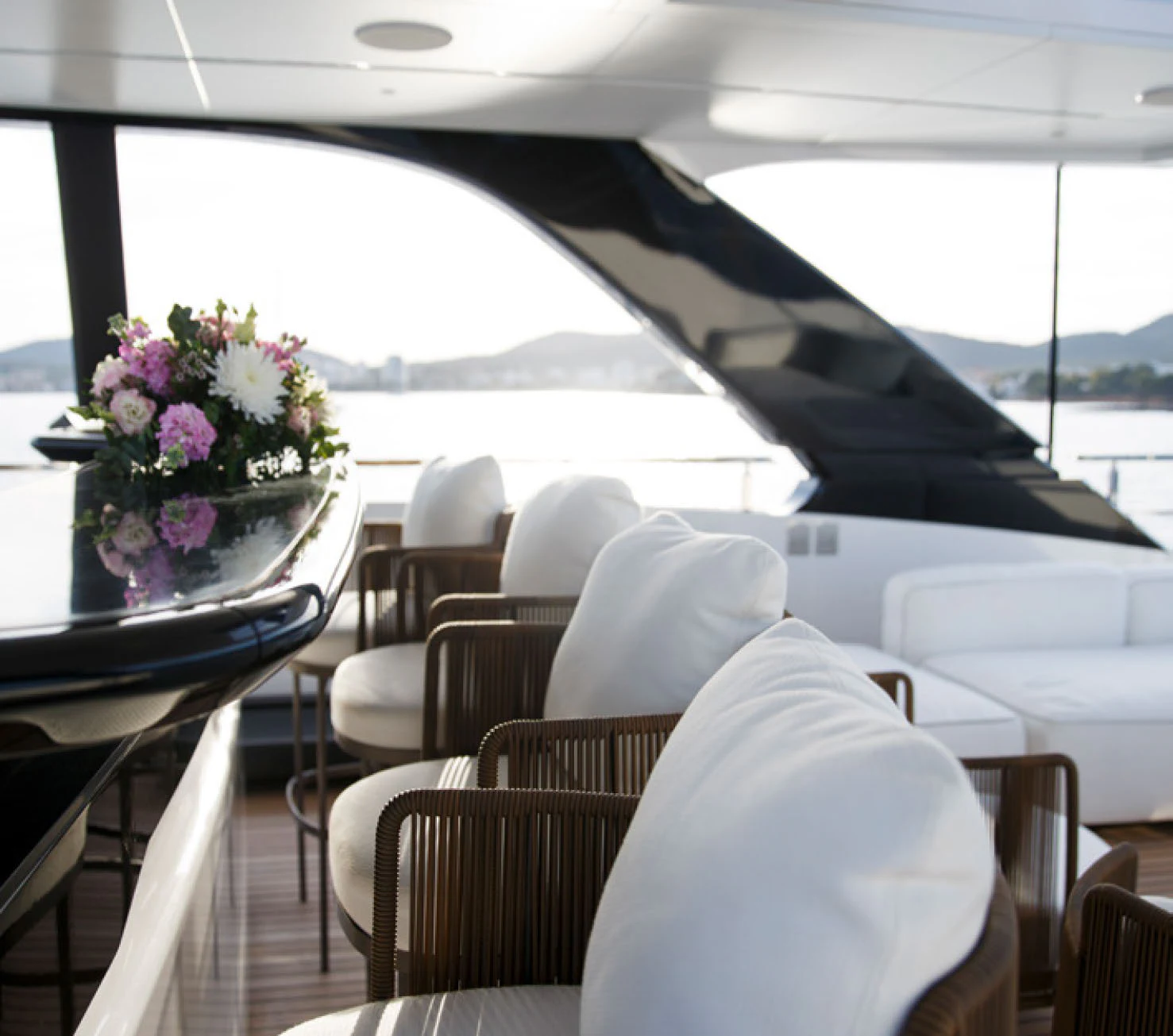 a room with tables and chairs aboard PERLA BIANCA Yacht for Charter